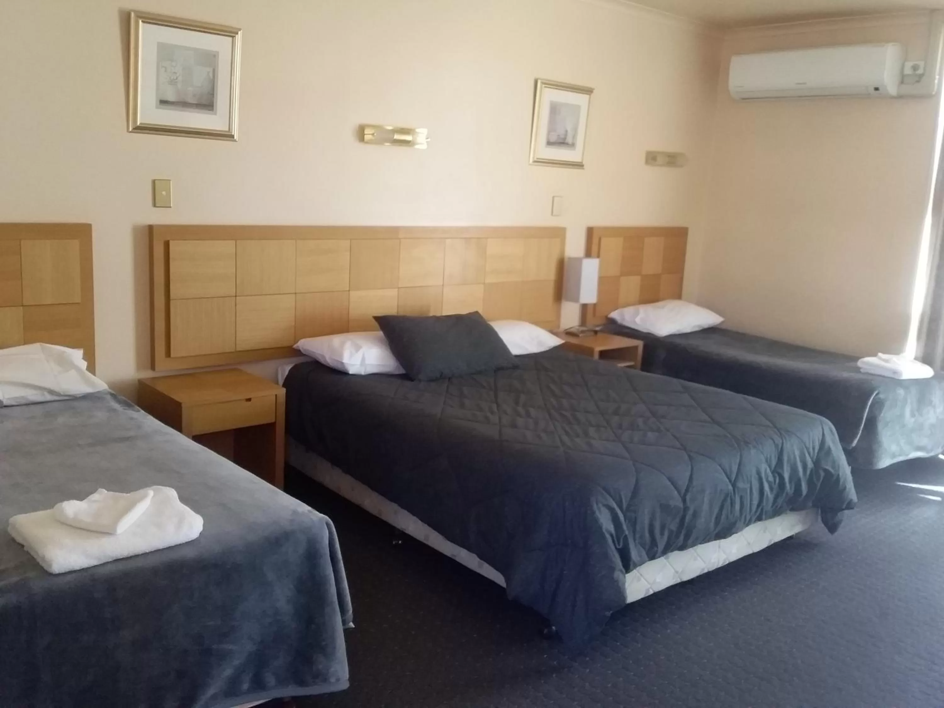 Bed in Desert Sand Motor Inn