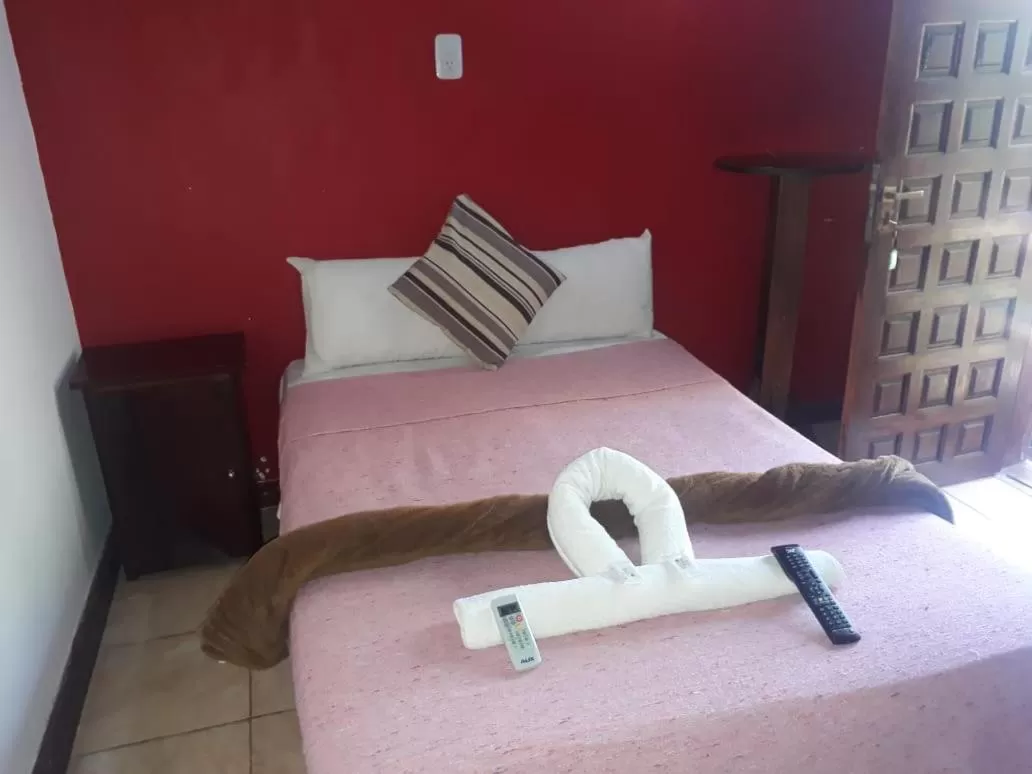 Bed in Petit Hotel Caraguata