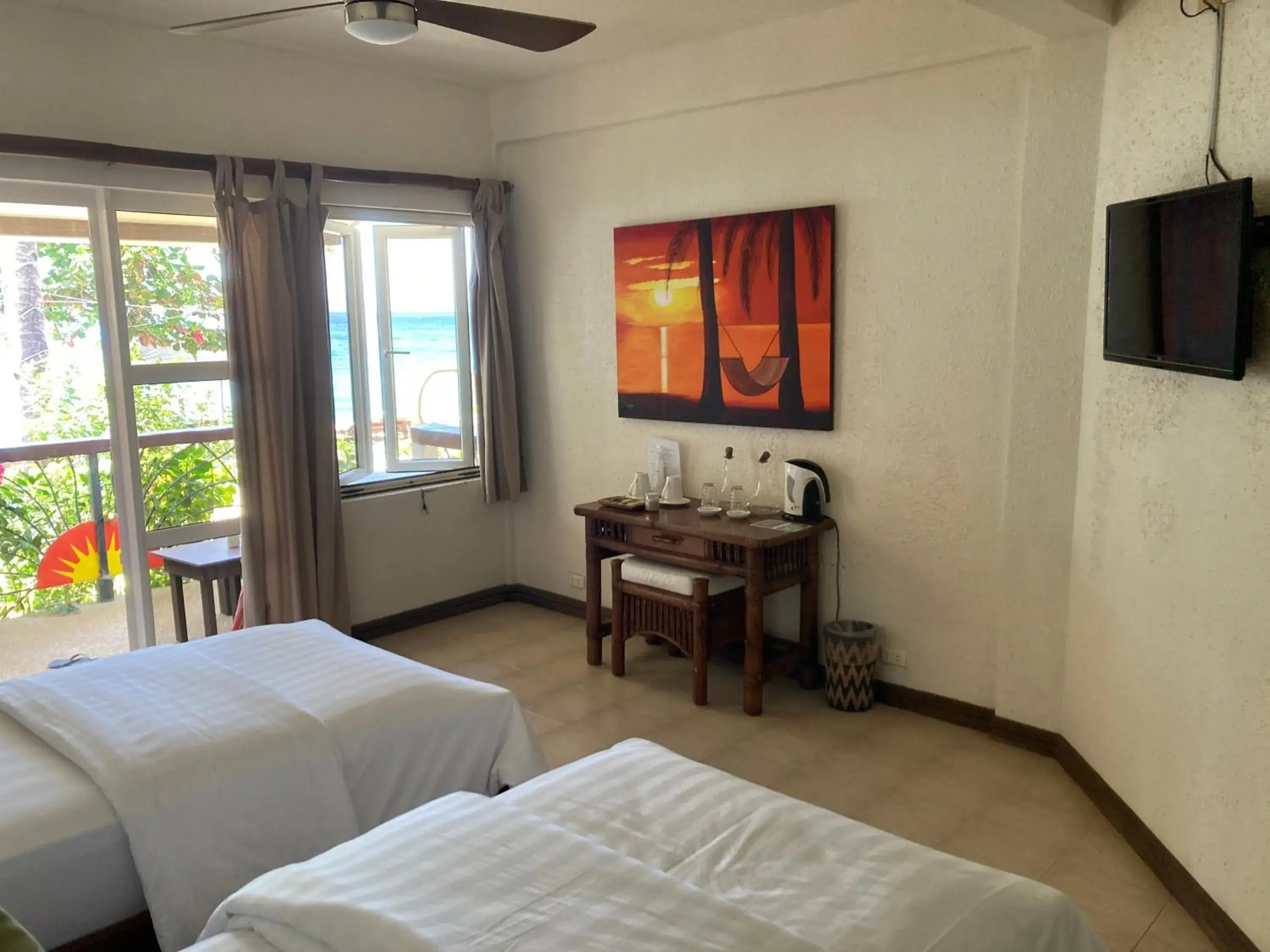 Twin Room in Sunset At Aninuan Beach Resort Twin Room in Sunset At Aninuan Beach Resort