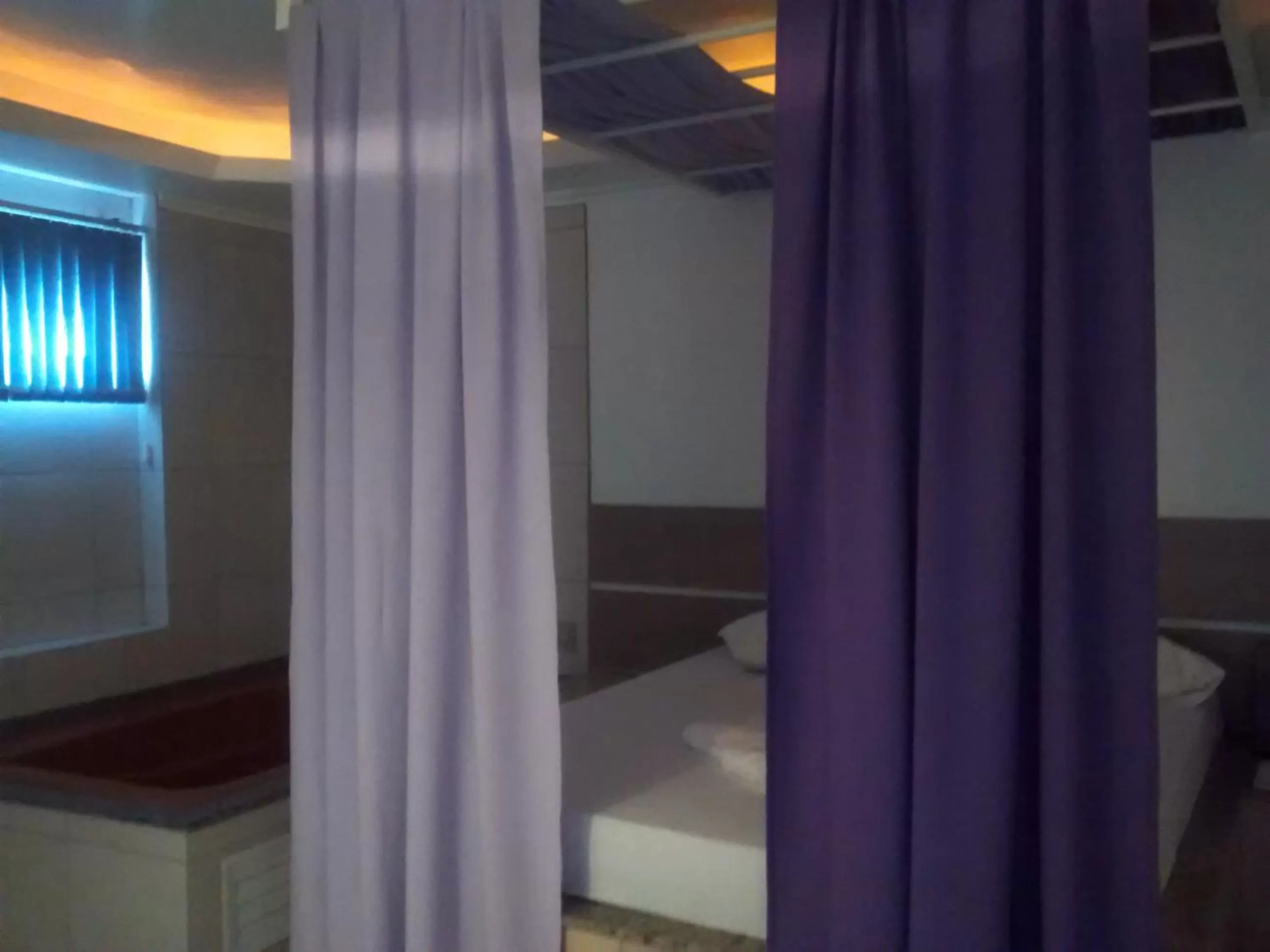 Bedroom in Classic Hotel e Motel