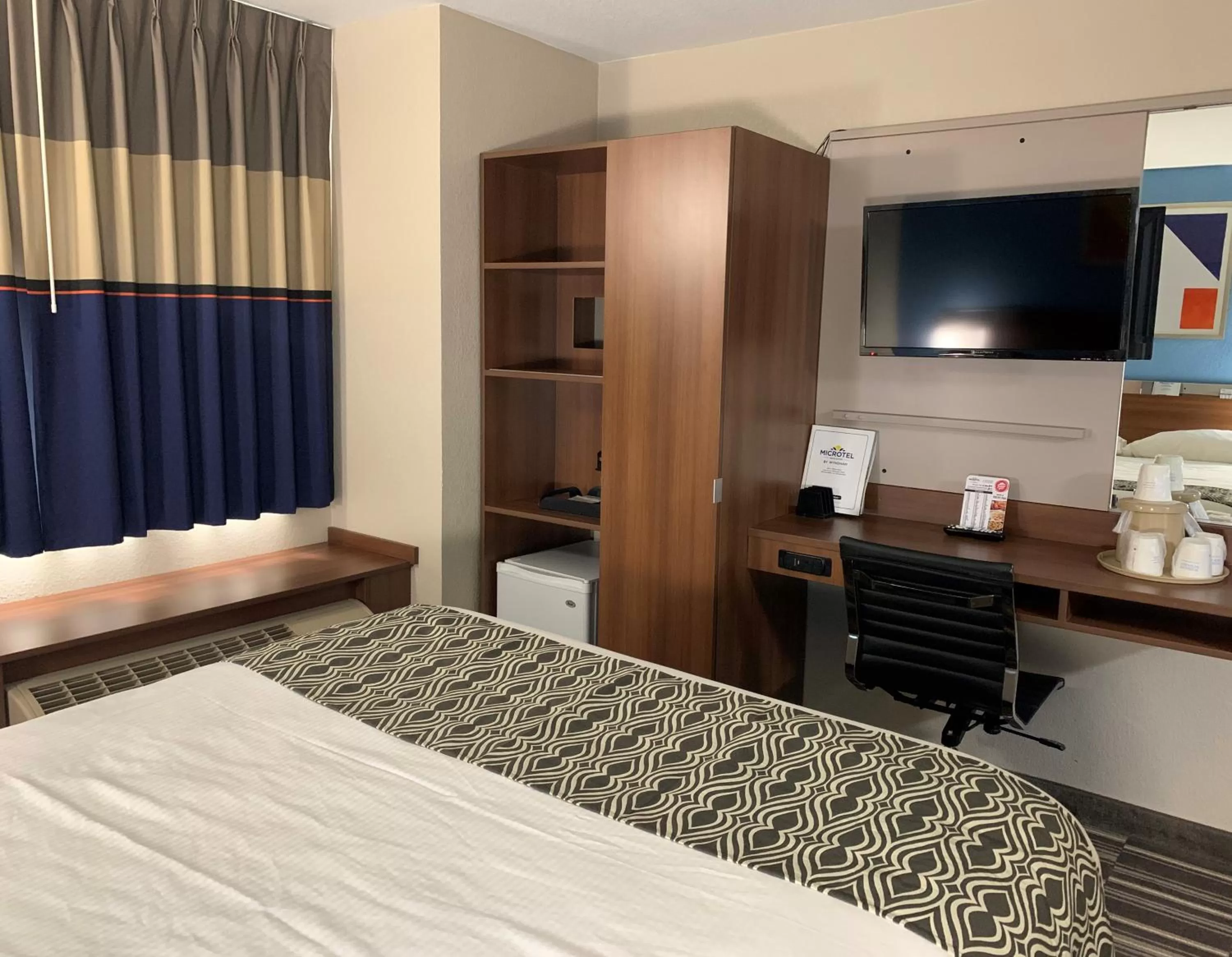 Bed in Microtel Inn & Suites by Wyndham Fond Du Lac