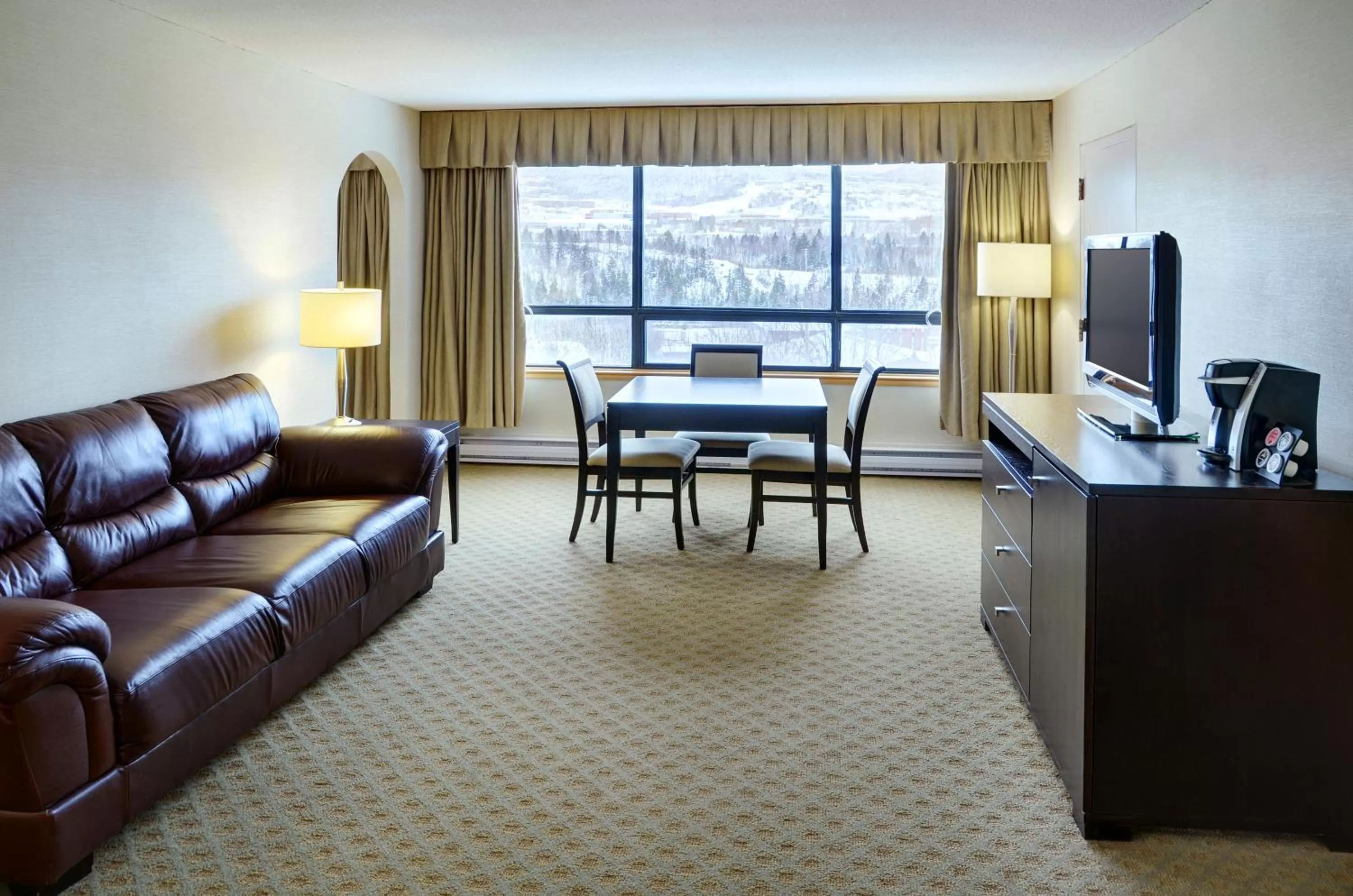 Living room in Greenwood Inn & Suites