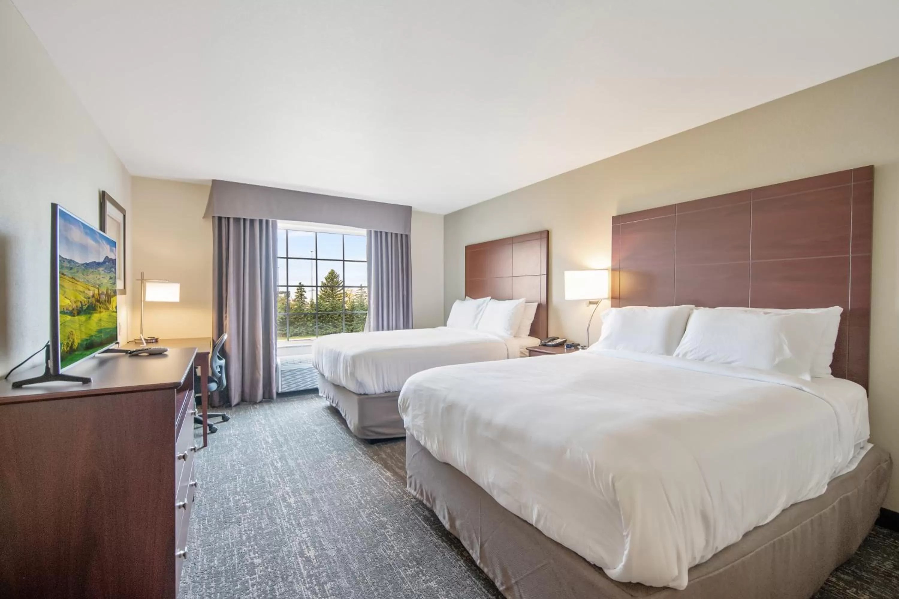 Bed in Cobblestone Hotel & Suites - Austin