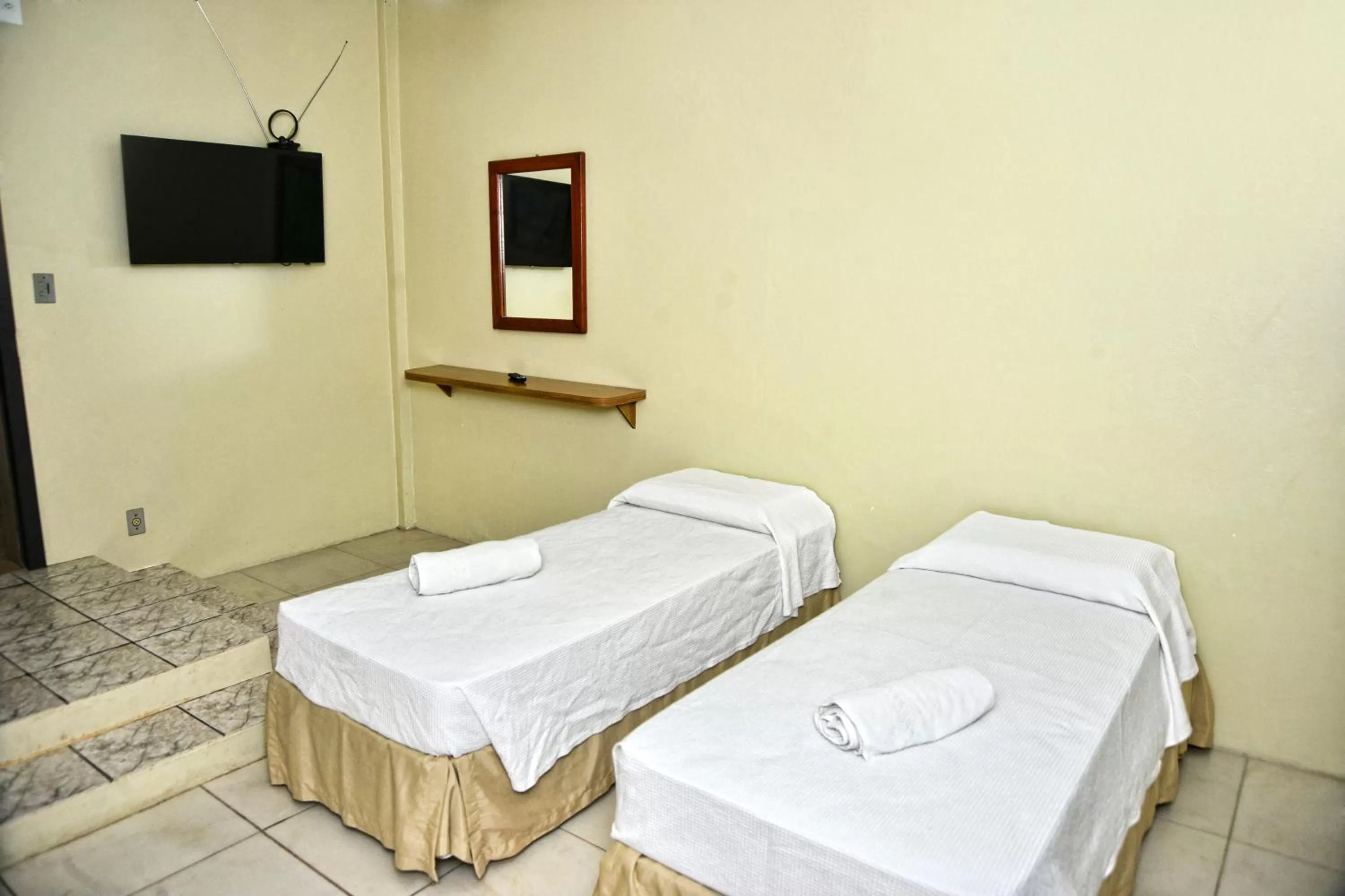 Bed in De Rose Palace Hotel