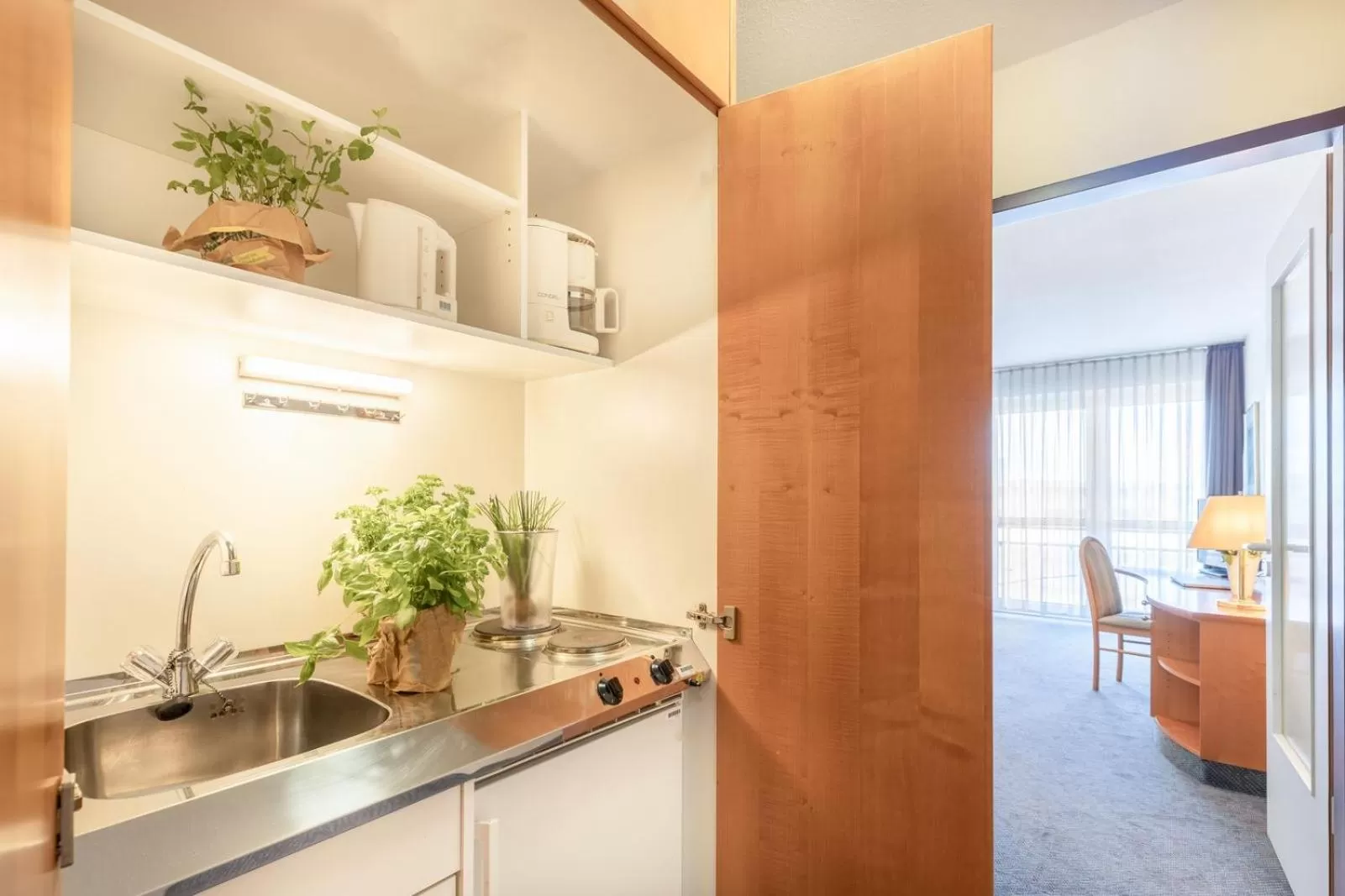 Kitchen or kitchenette in acora Leipzig Living the City