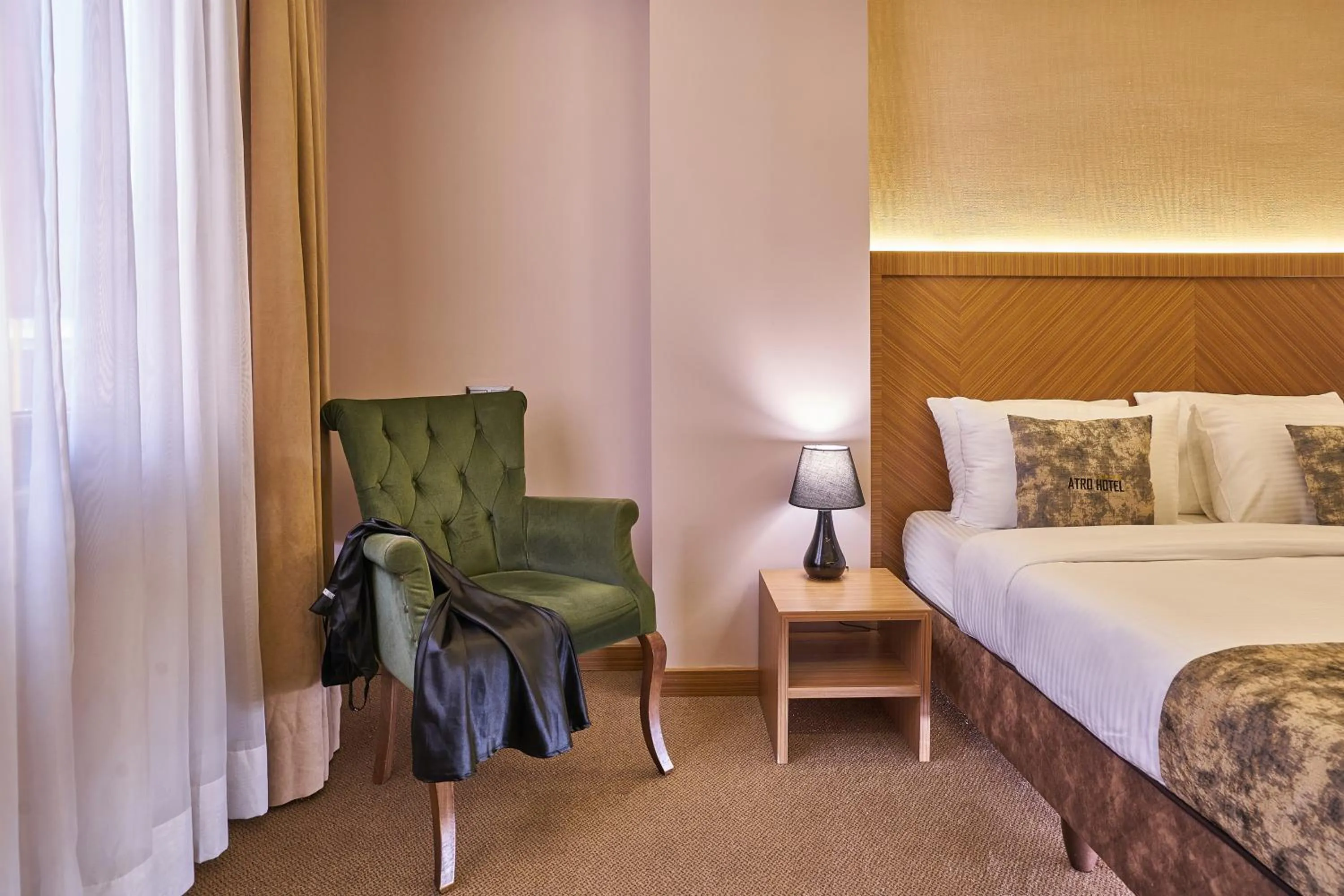 Seating area, Bed in Atro Hotel