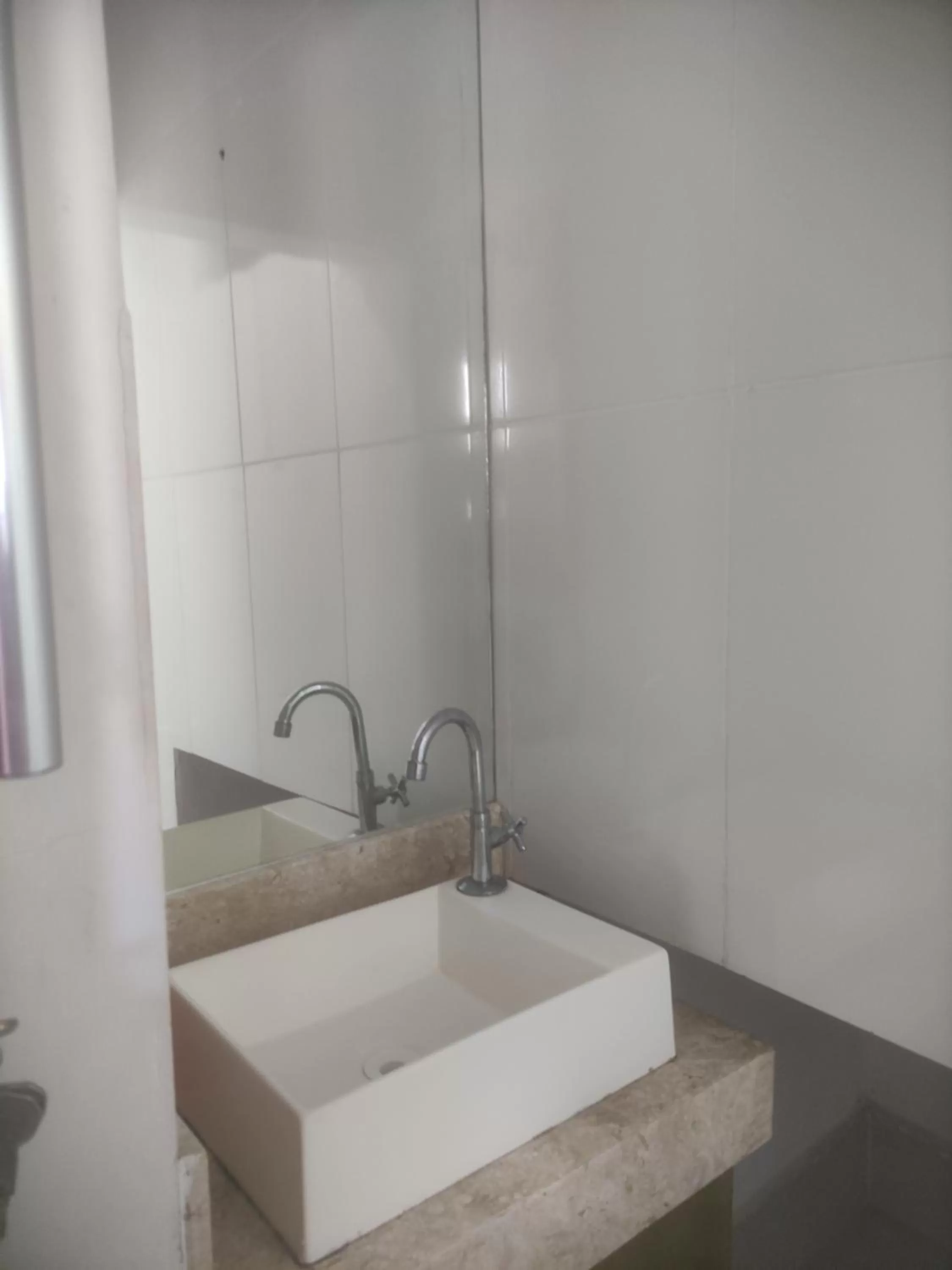 Bathroom in Pousada da Gi Suítes e Turismo