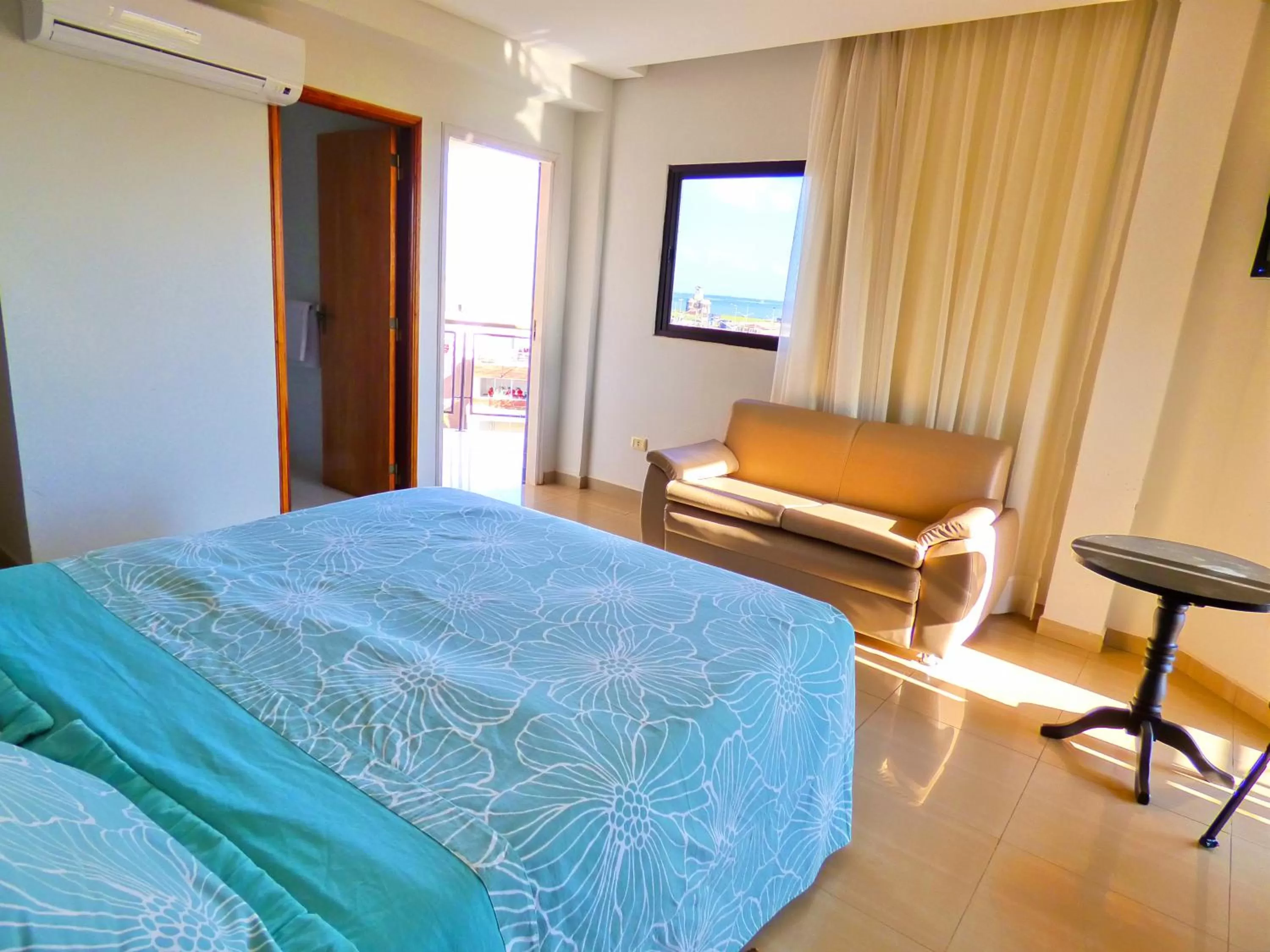 Bed in De La Costa Hotel