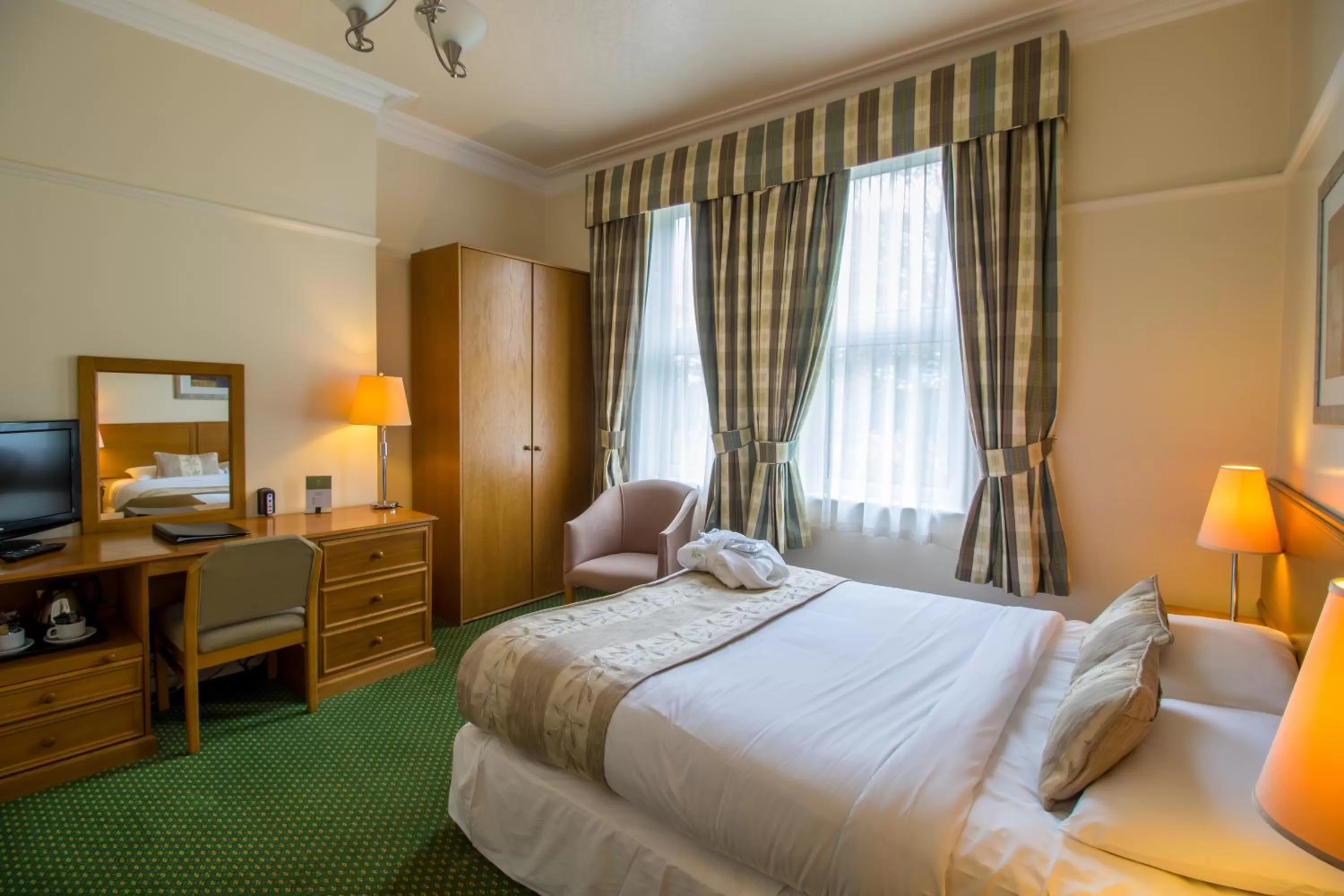 Toilet, Bed in A Park View Hotel