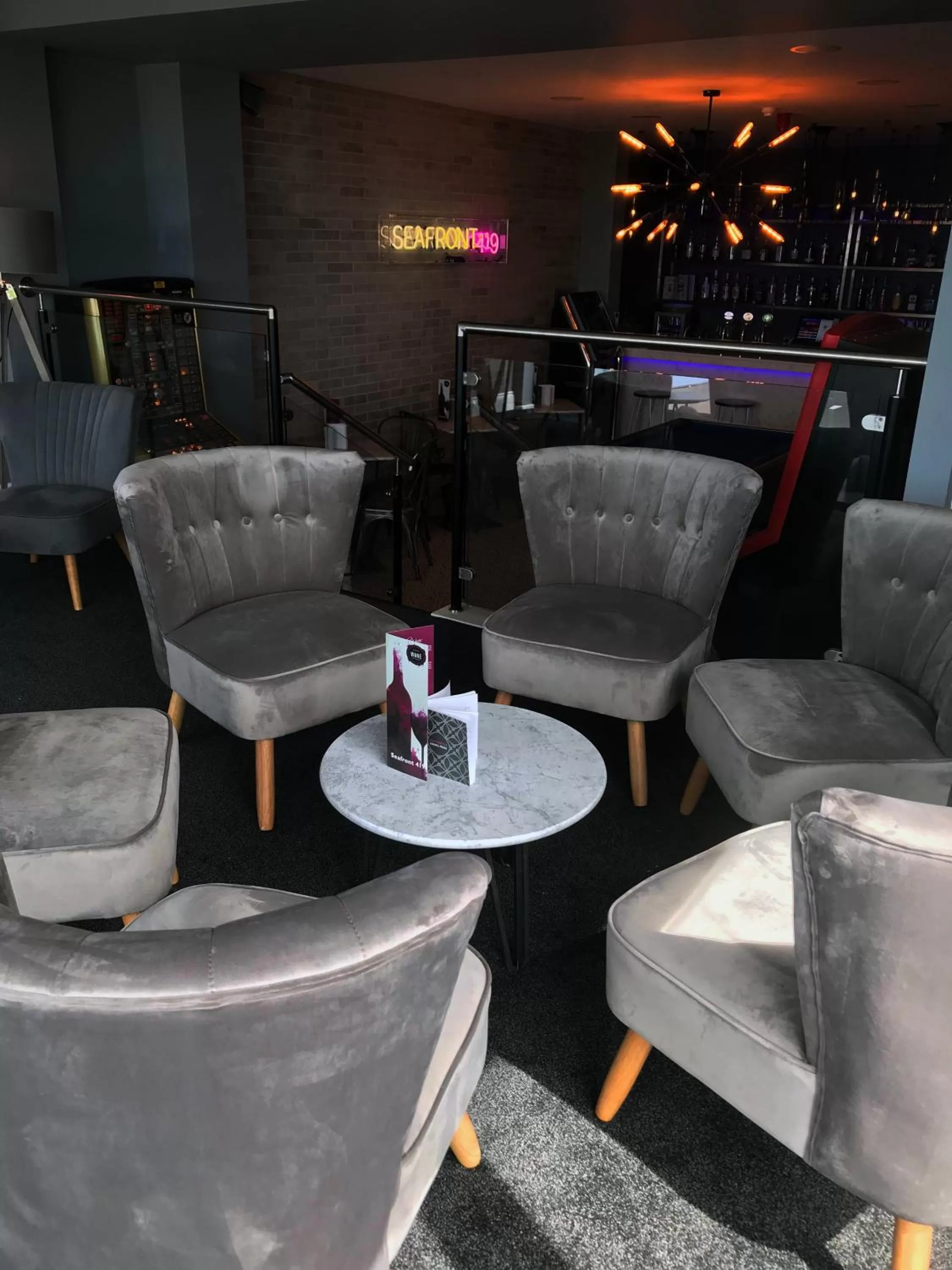 Communal lounge/ TV room in ApartHotel421 by Seafront Collection