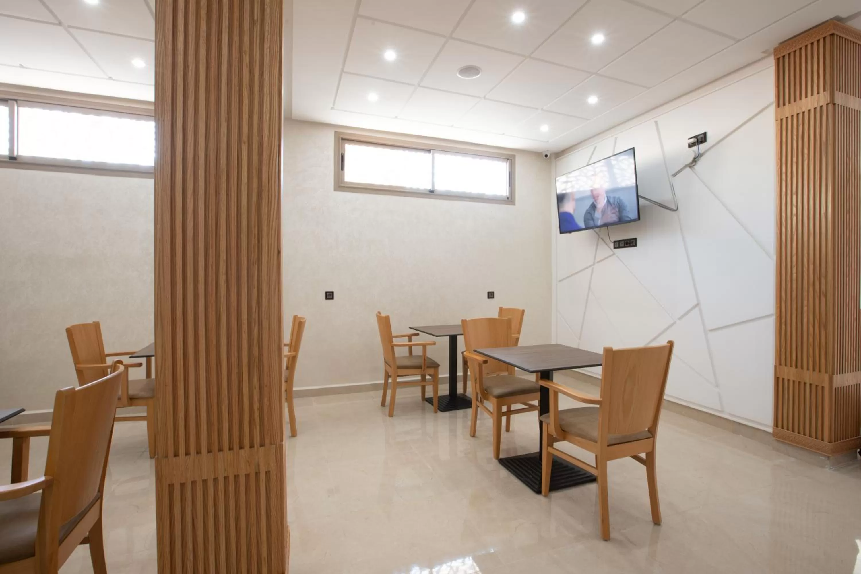 Communal lounge/ TV room in Karam City Hotel