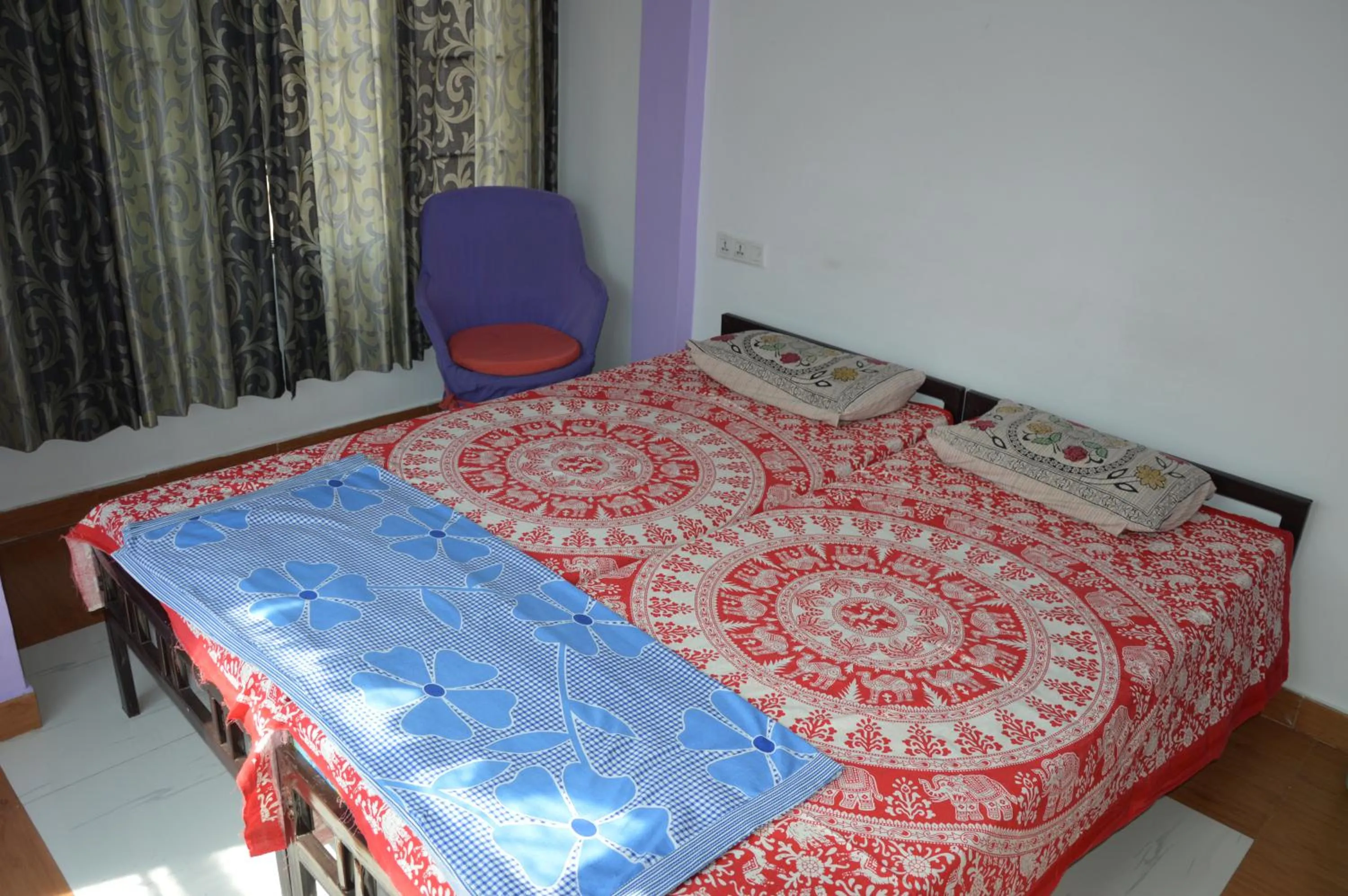 Bed in Udai Haveli Guest House