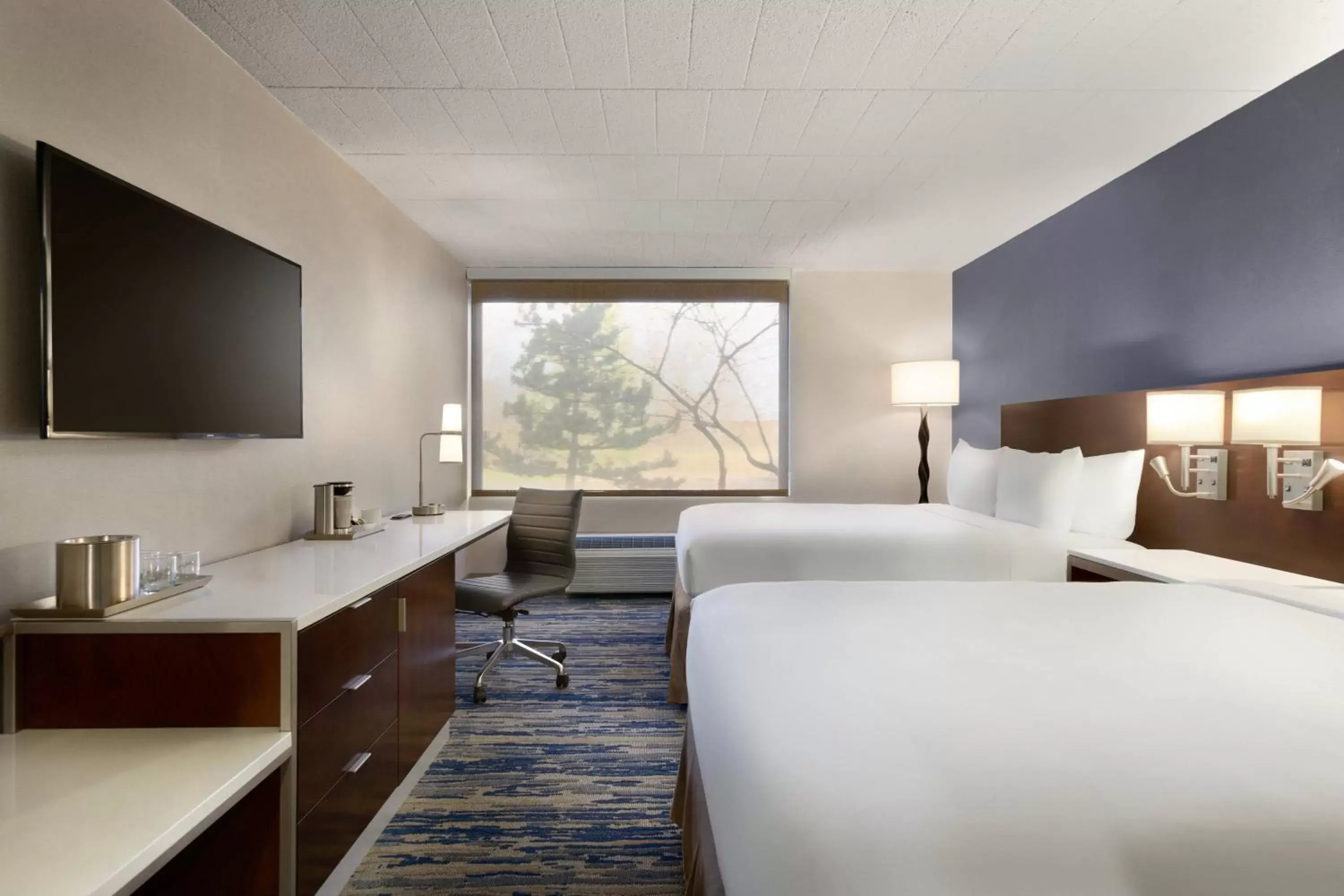 Guest Room with Two Queen Beds in Skyline Hotel Detroit Airport, SureStay Collection by Best Western Guest Room with Two Queen Beds in Skyline Hotel Detroit Airport, SureStay Collection by Best Western