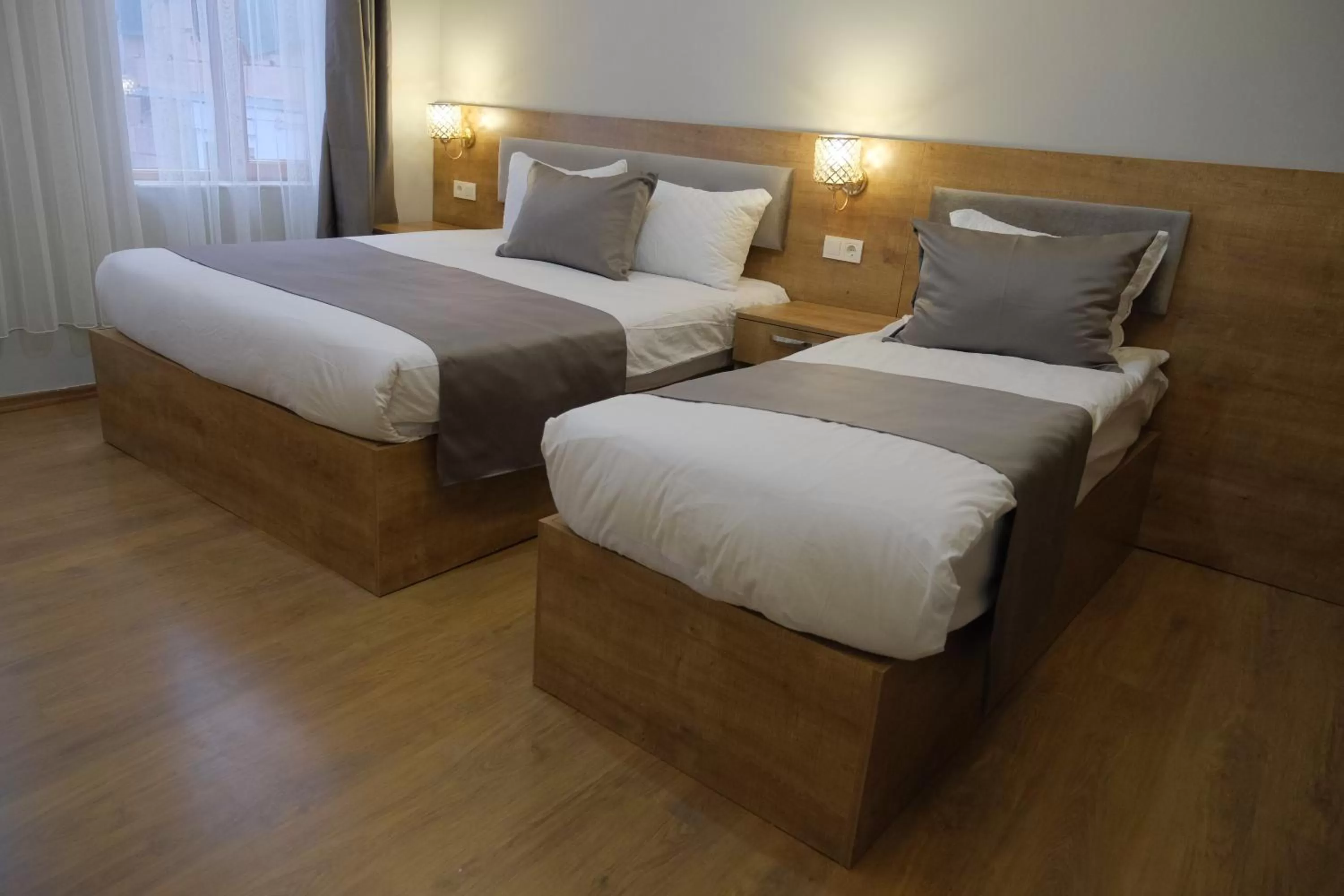 Bed in Adamantides Hotel