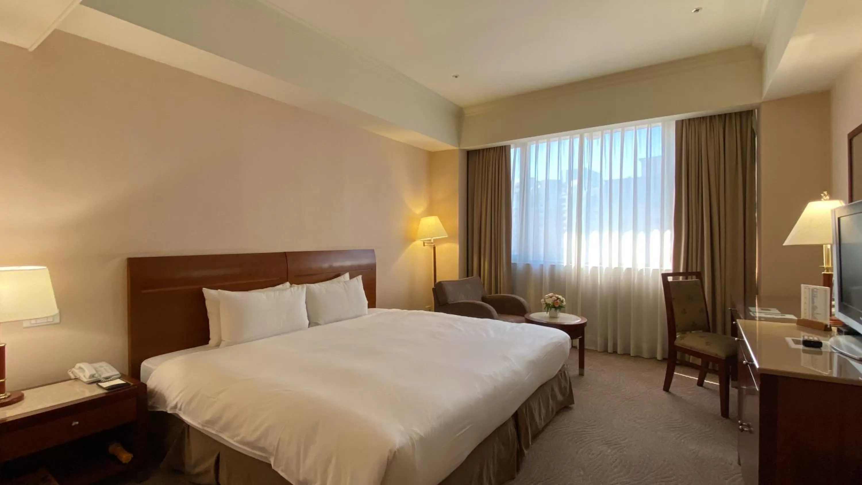 Bed in Monarch Plaza Hotel