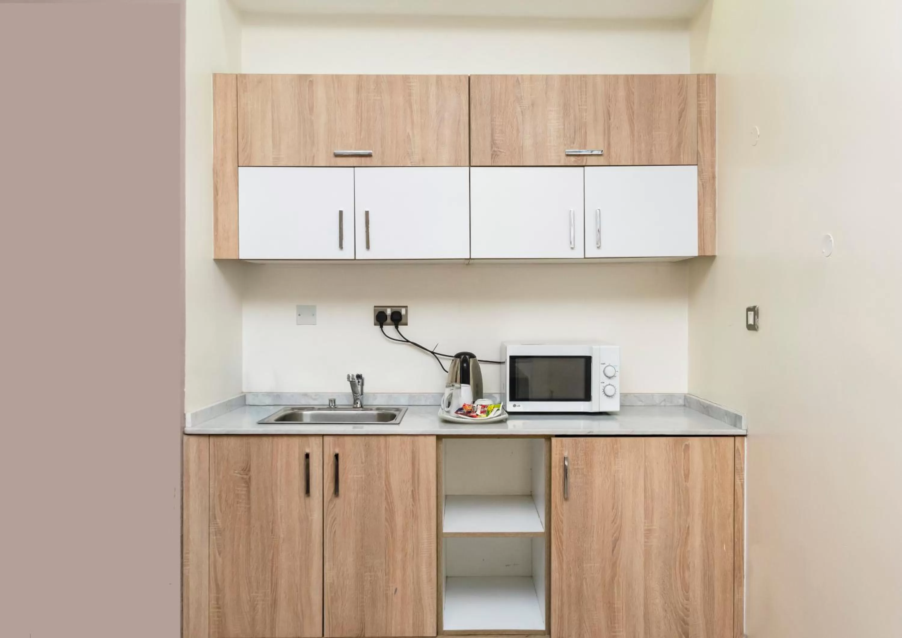 Kitchen or kitchenette in Hawthorn Suites by Wyndham Abuja