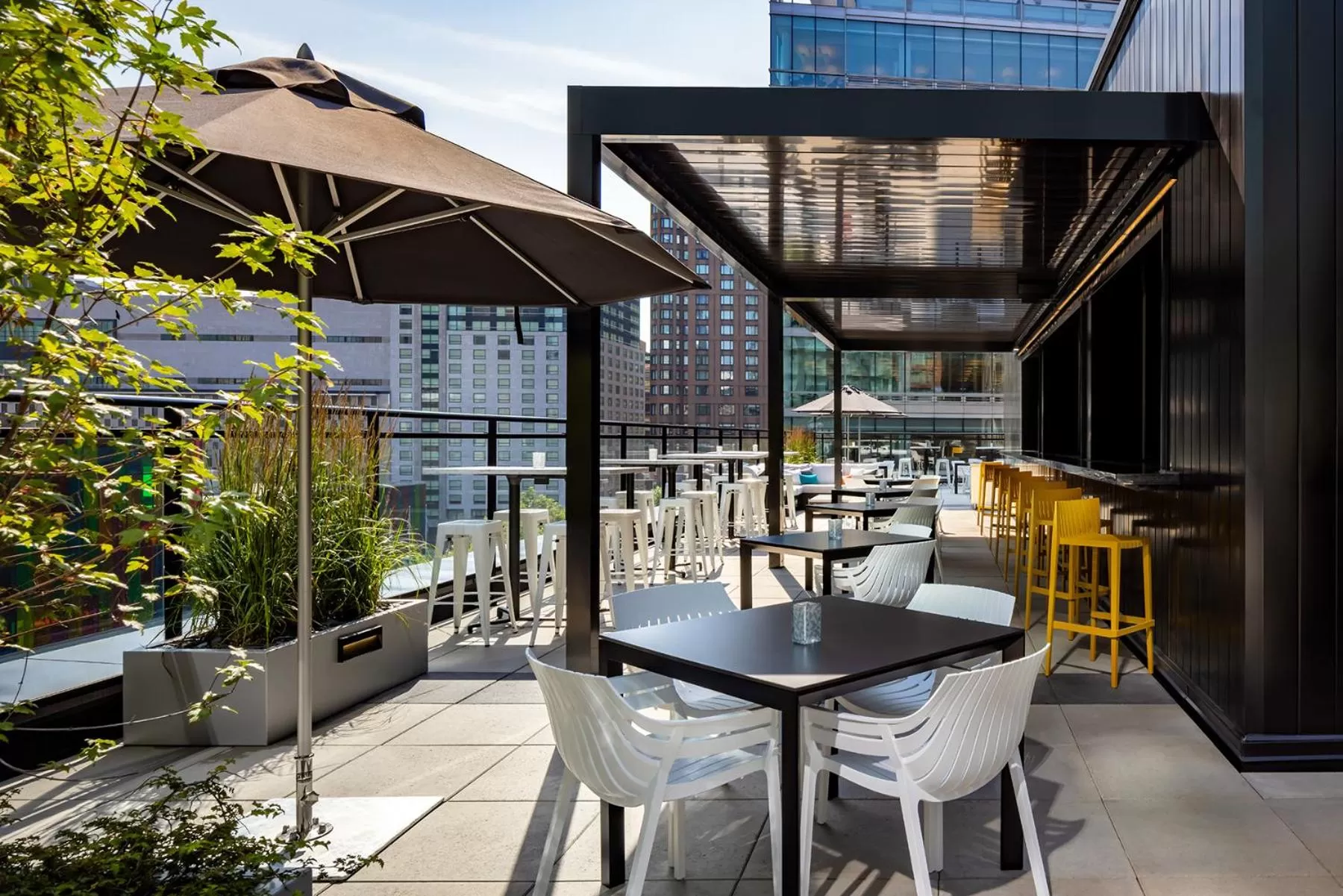 Patio in Humaniti Hotel Montreal, Autograph Collection