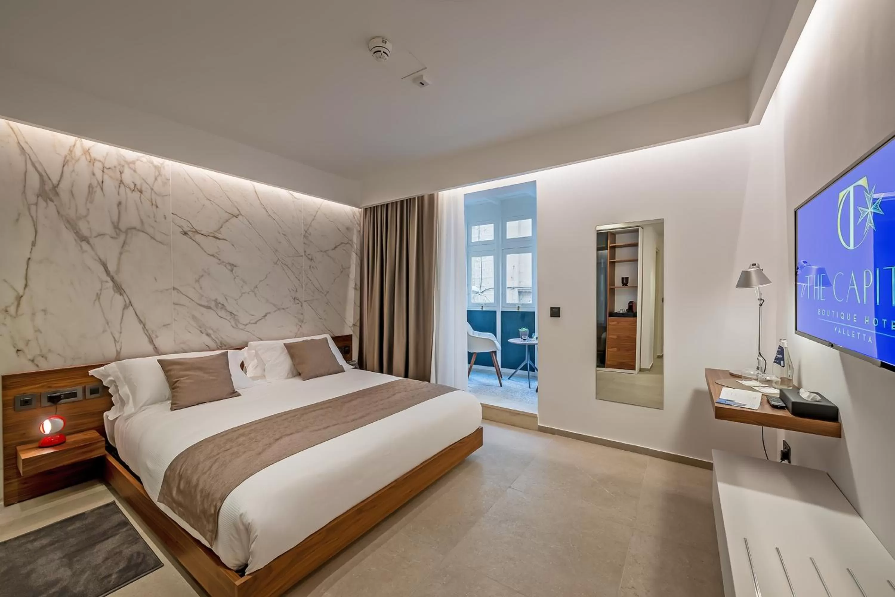 Bed in The Capital Boutique Hotel