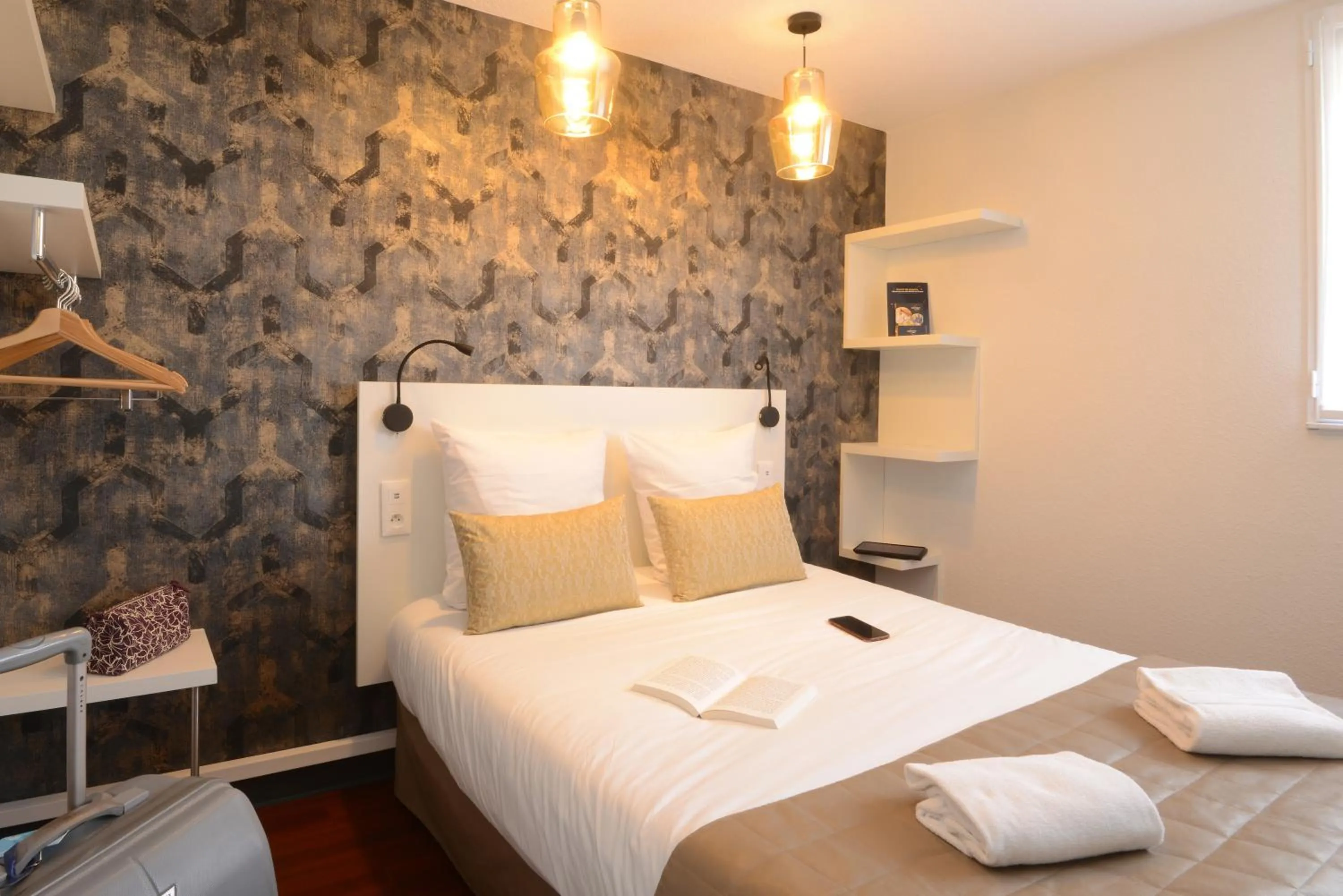 View (from property/room), Bed in Hotel Arc-En-Ciel Colmar Contact Hotel