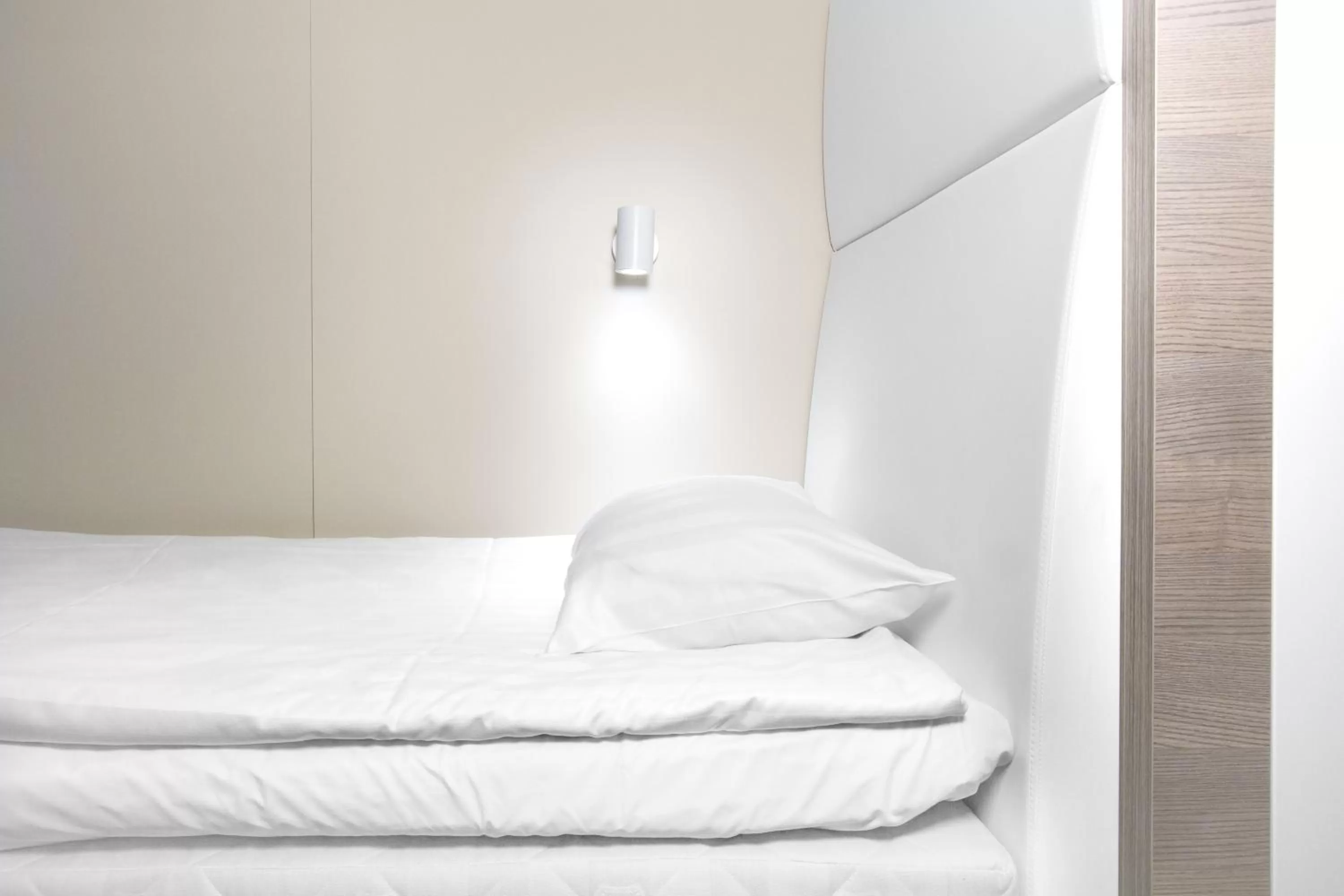 Bed in Omena Hotel Helsinki Lönnrotinkatu