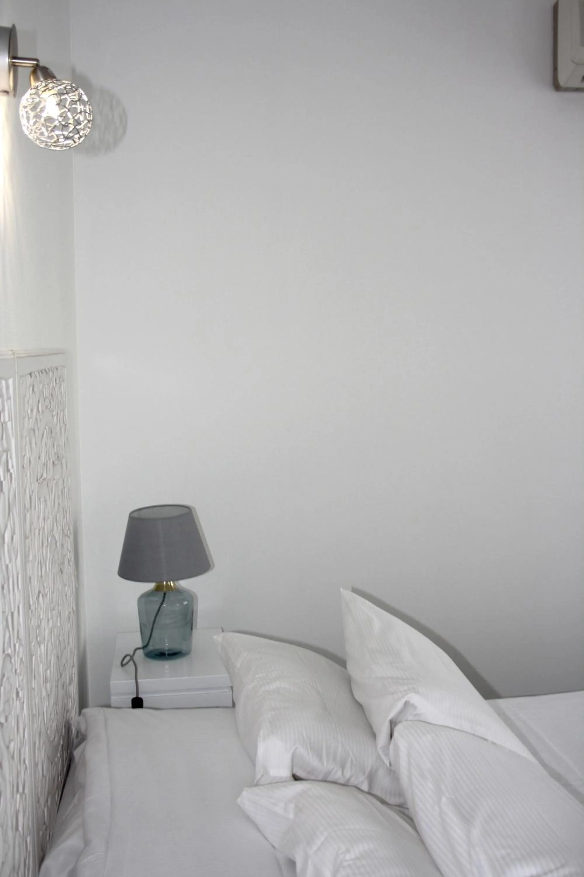 Bed in Logis Hôtel Sea View