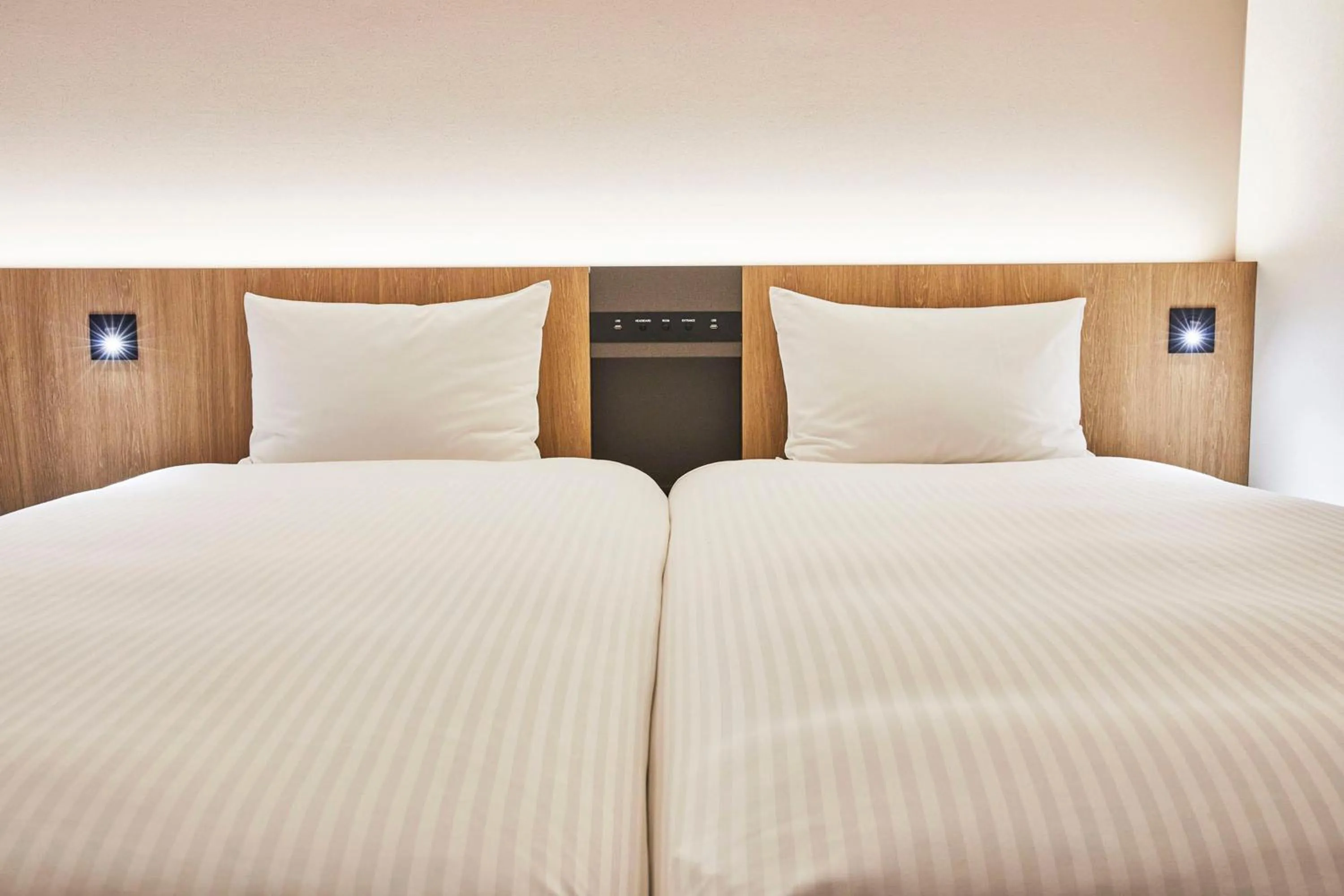 Bed in Hotel Lumiere Kasai