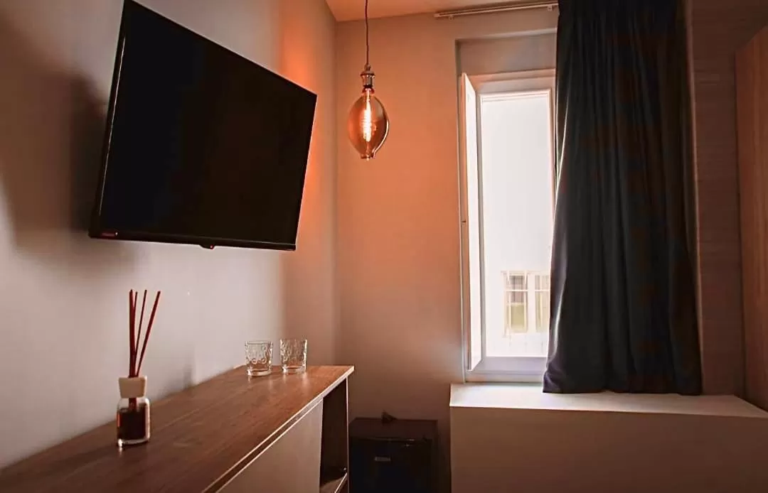 Photo of the whole room, TV/Entertainment Center in Il Campanile Premium B&b