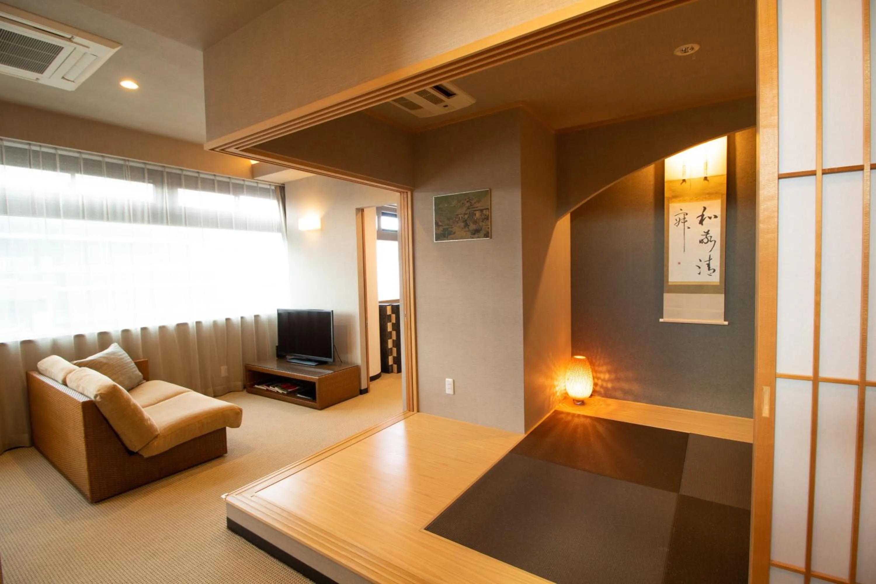 Living room, Bed in R&Run Kyoto Serviced Apartment & Suites