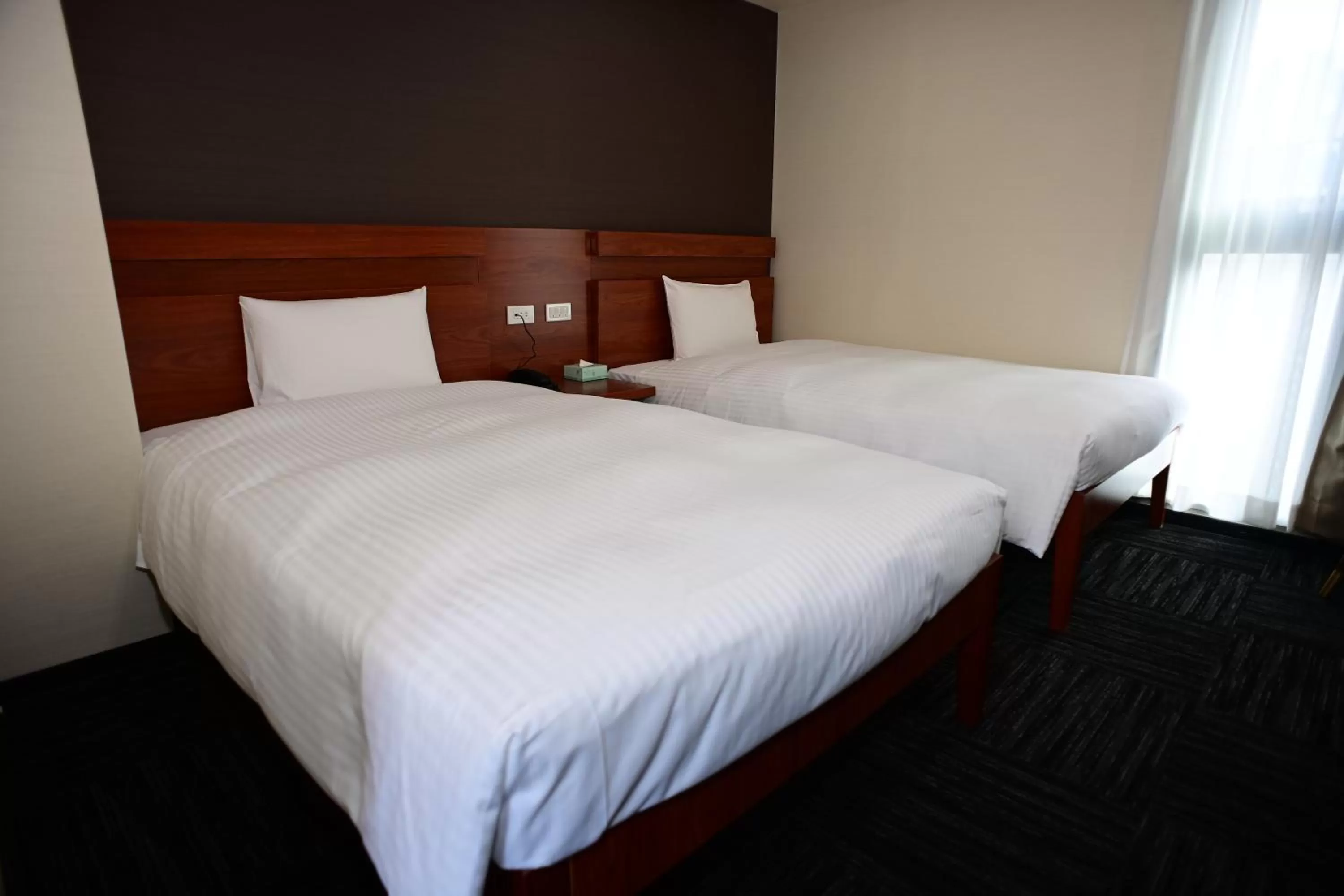 Bed in BRILLIANCE Hotel