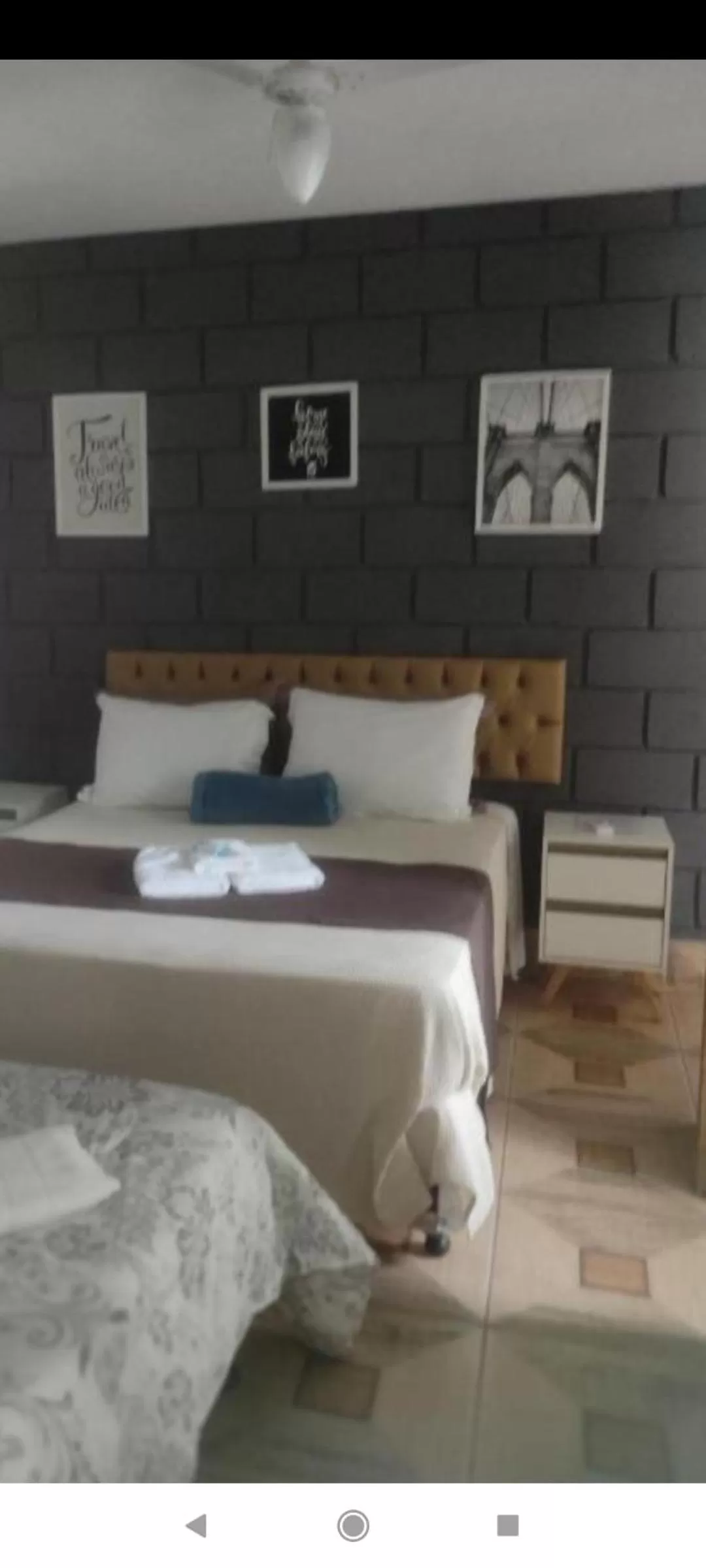 Bed in Pousada da Gi Suítes e Turismo