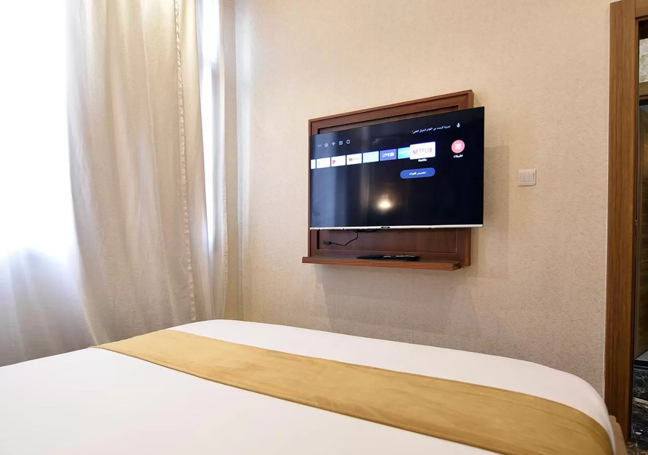 Bedroom, TV/Entertainment Center in Rihanna Hotel Apartment