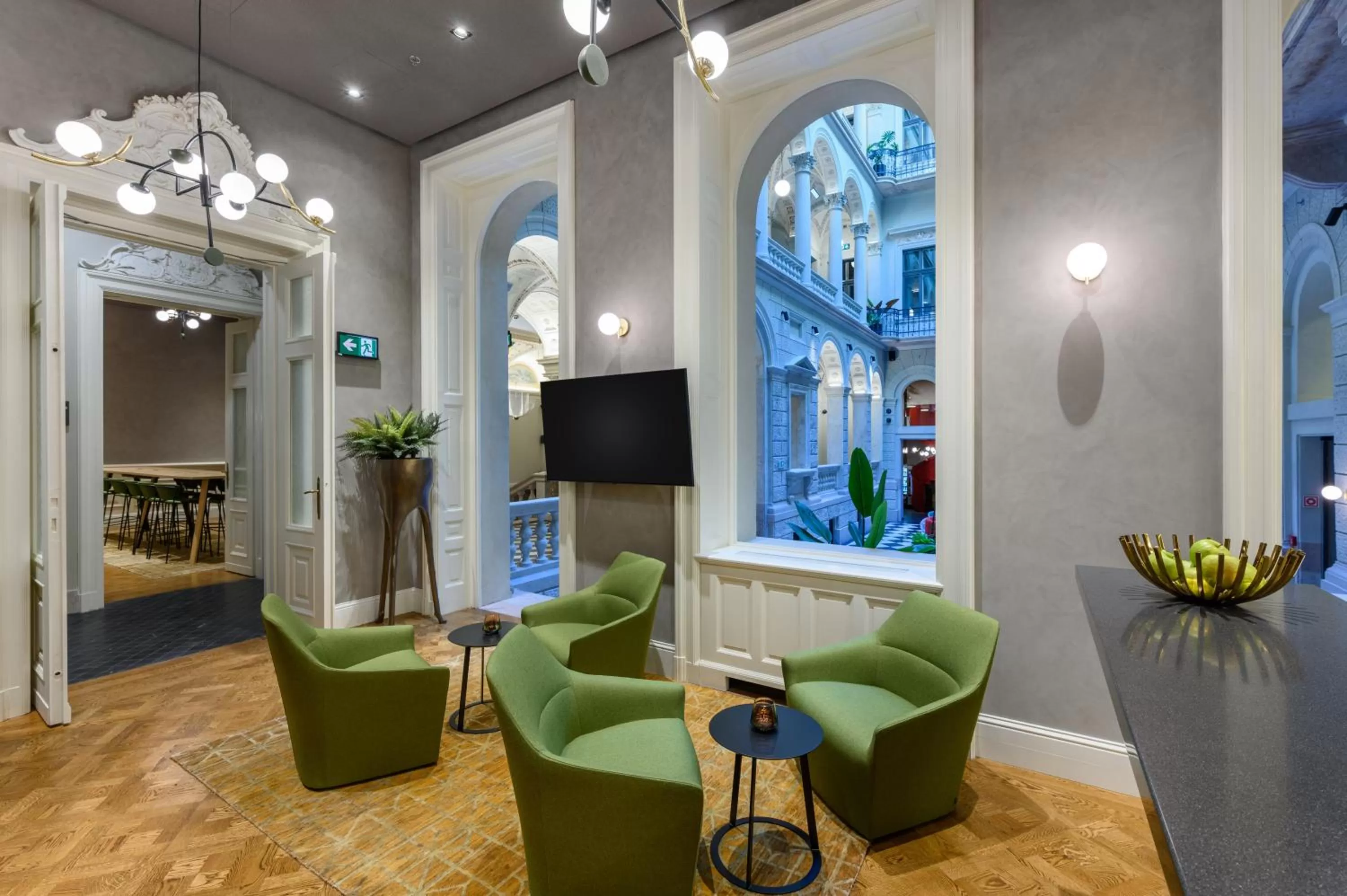 Communal lounge/ TV room in Hotel Oktogon Haggenmacher by Continental Group