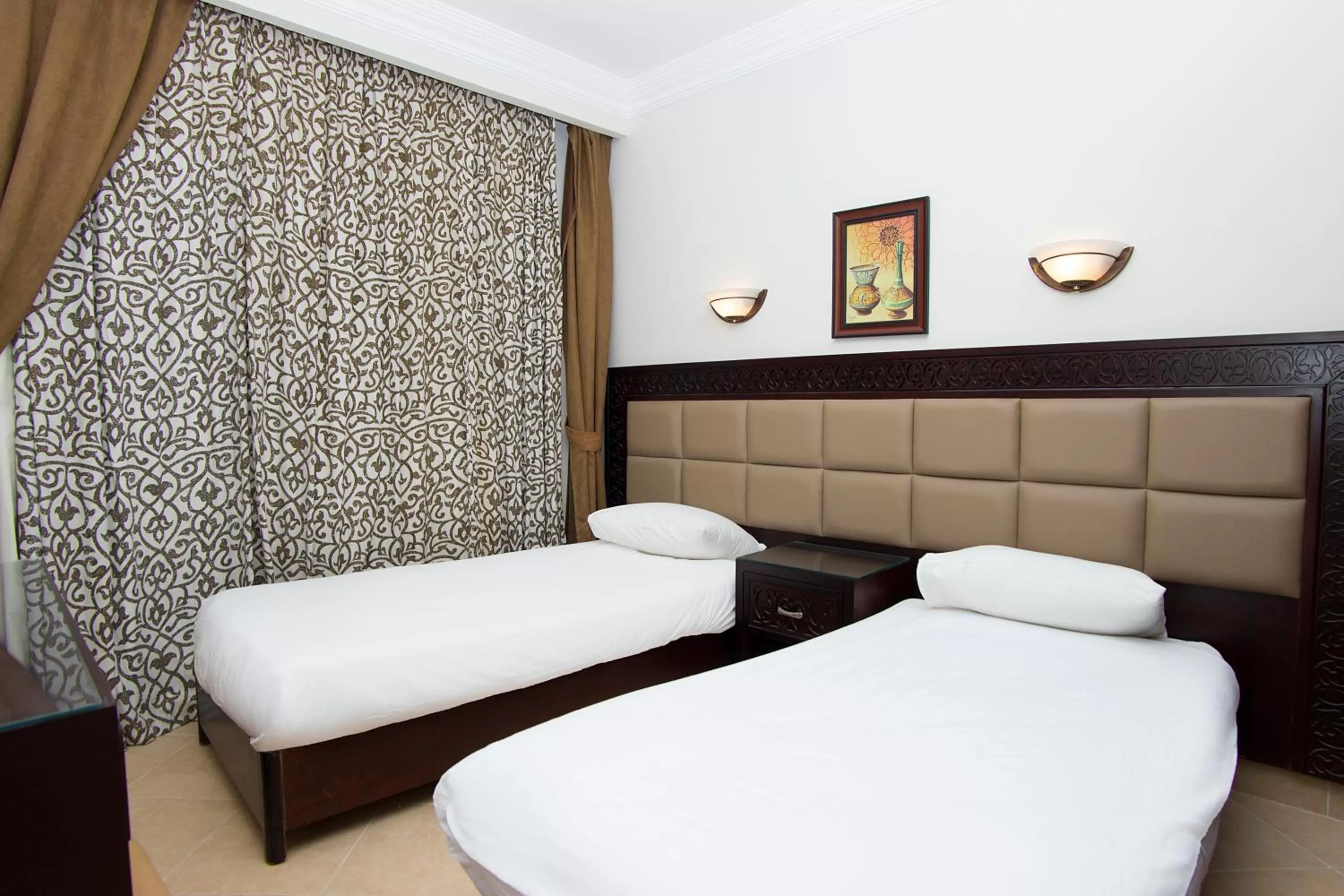 Bedroom in Pyramisa Sunset Pearl Apartments