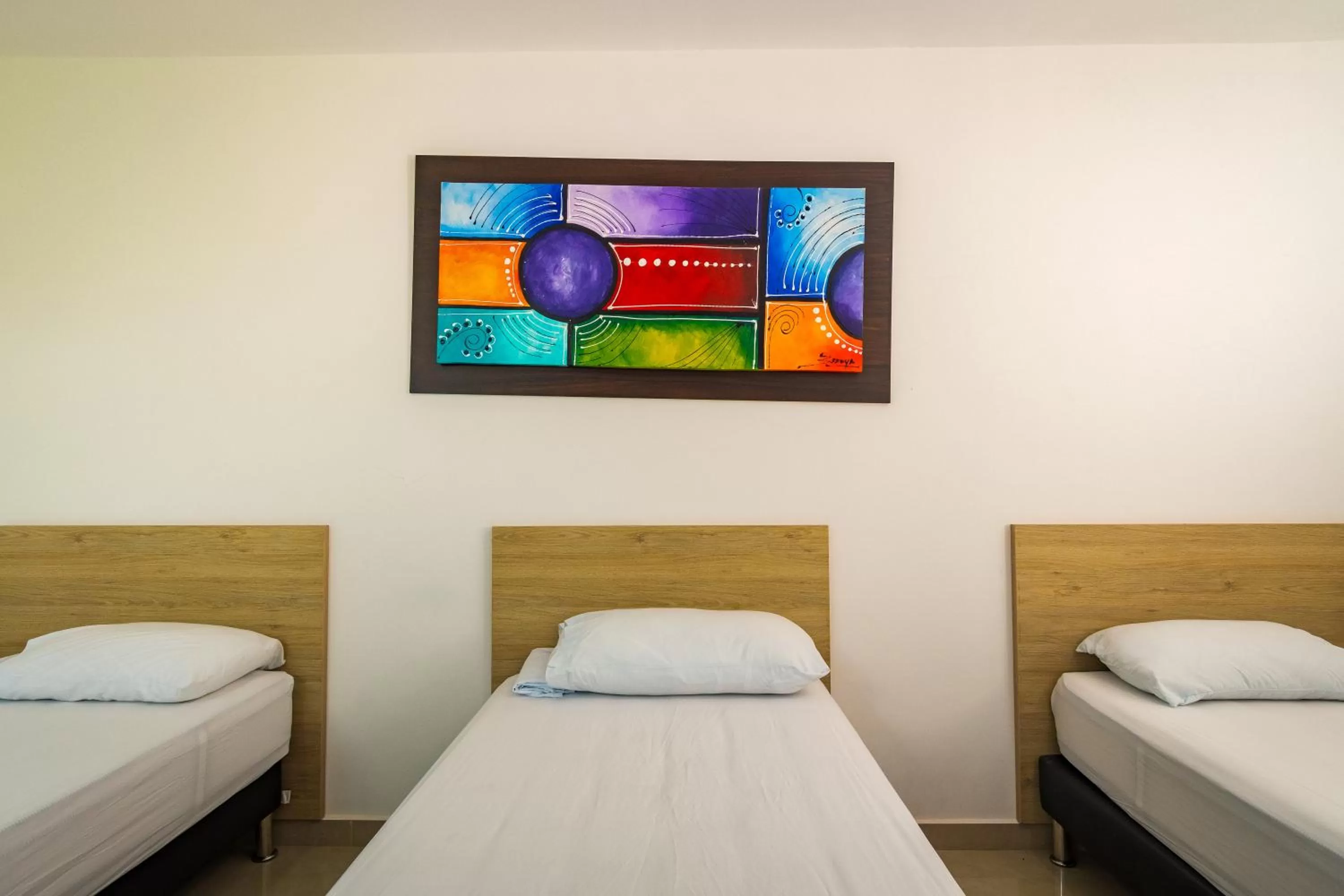 Bed in Genesis Hotel