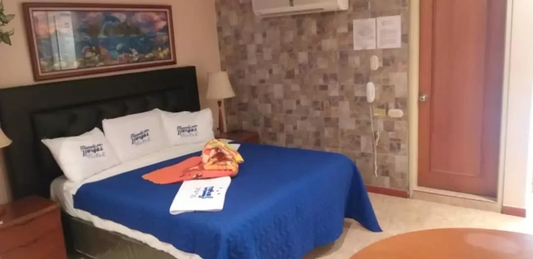 Bed in HOTEL MUEVETE POR VARGAS