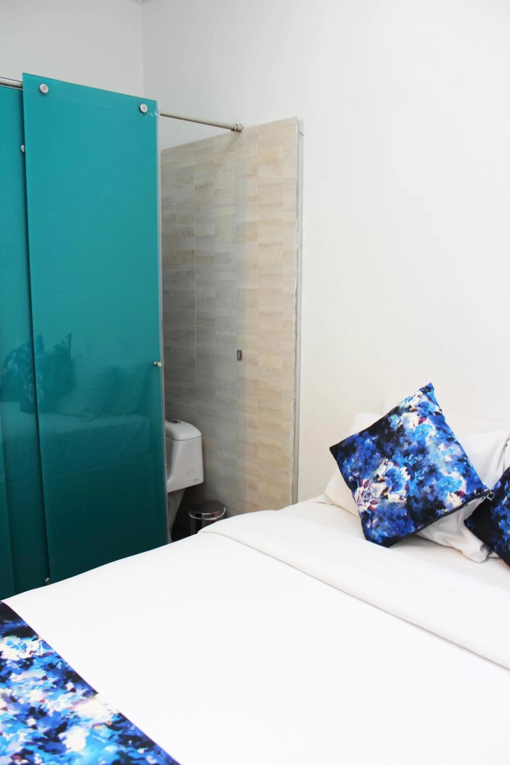 Bed in Agora Suites Self-Service Boutique Hotel