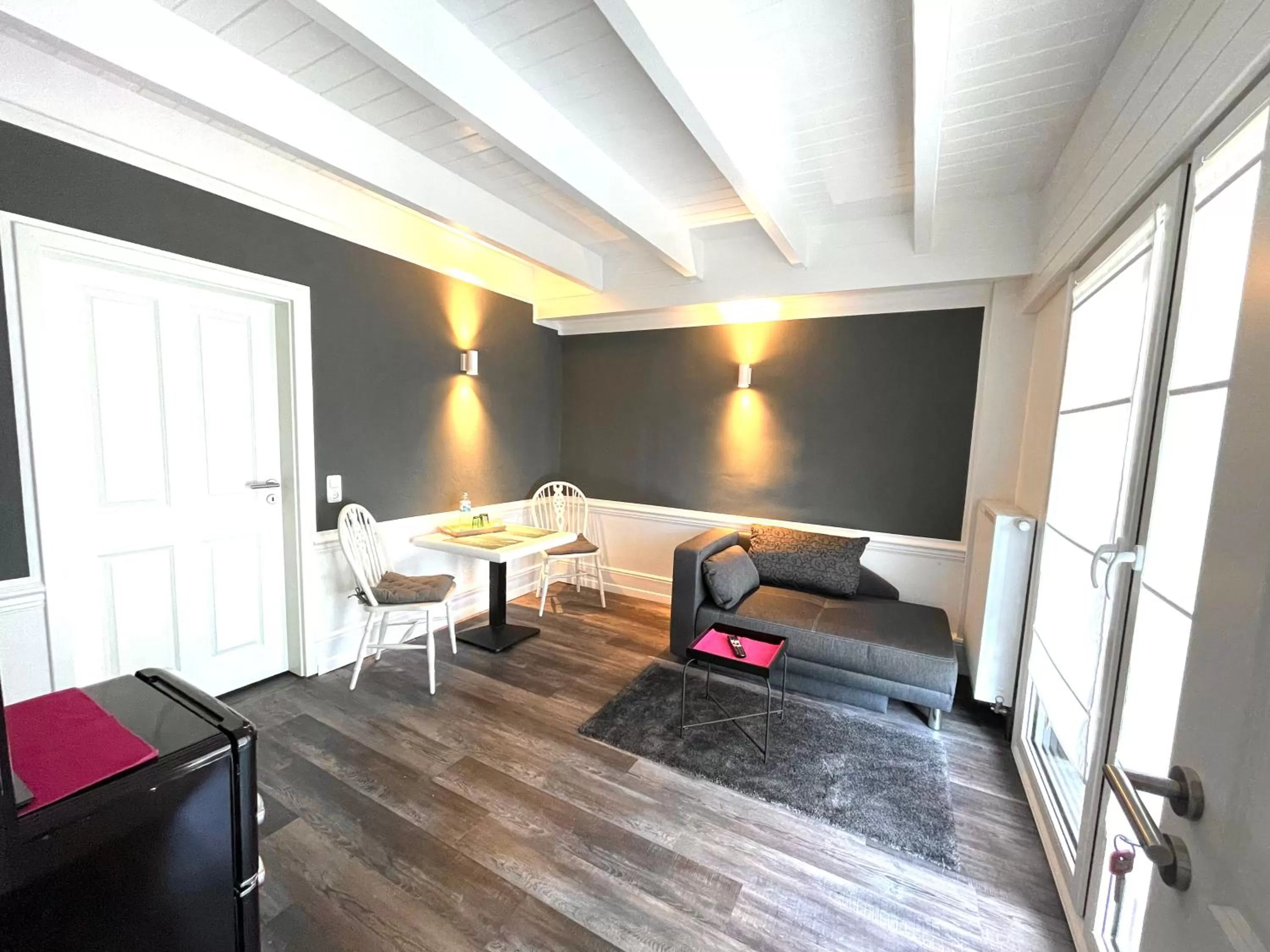 Living room, Bed in Rosenhof-Lodge