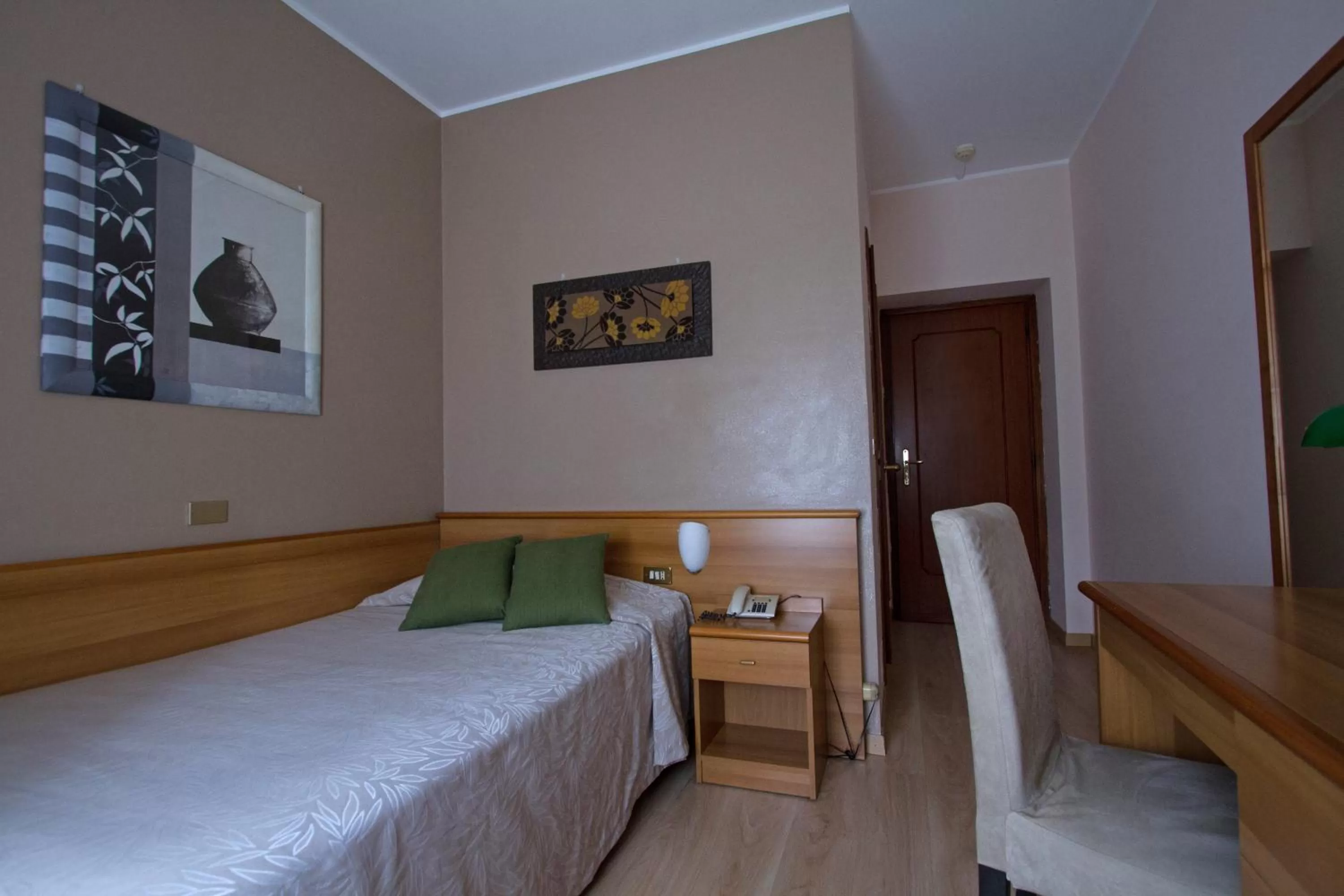 Bed in Hotel Adriano