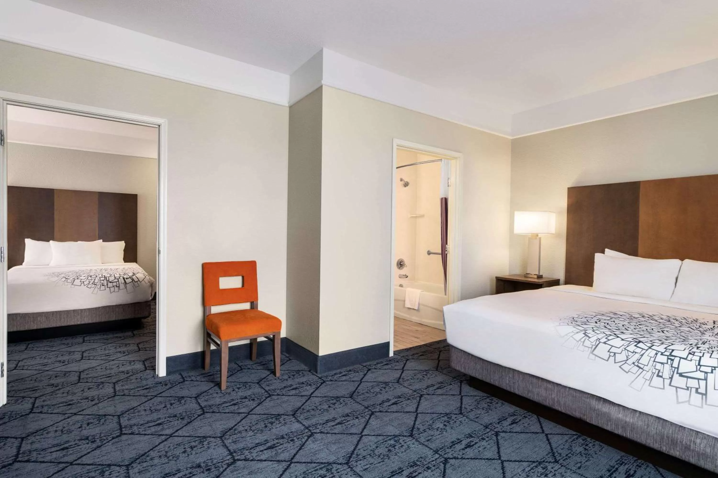 Bed in La Quinta Inn and Suites by Wyndham at WaTiki Waterpark