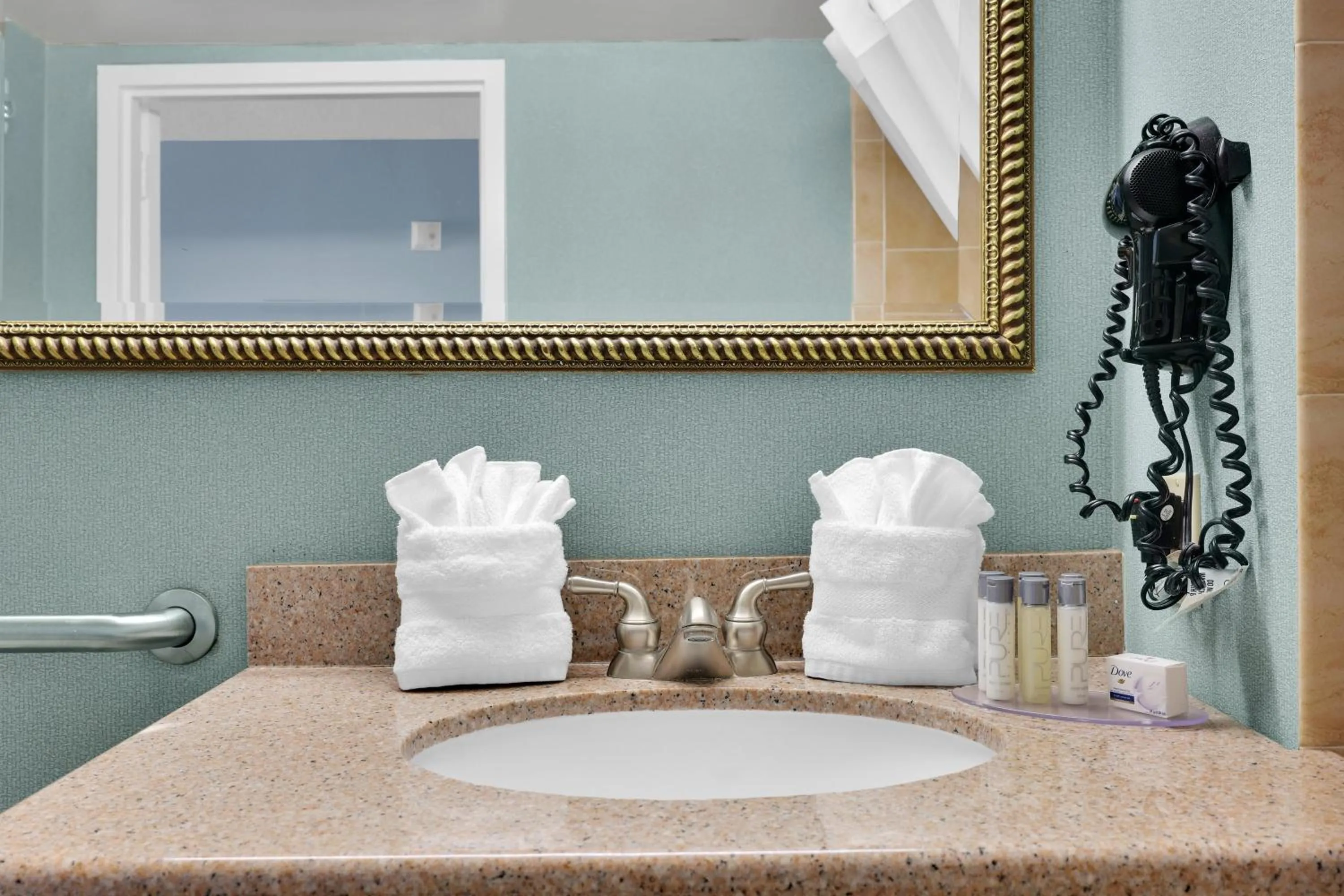 Bathroom in Ramada by Wyndham Jacksonville I-95 by Butler Blvd