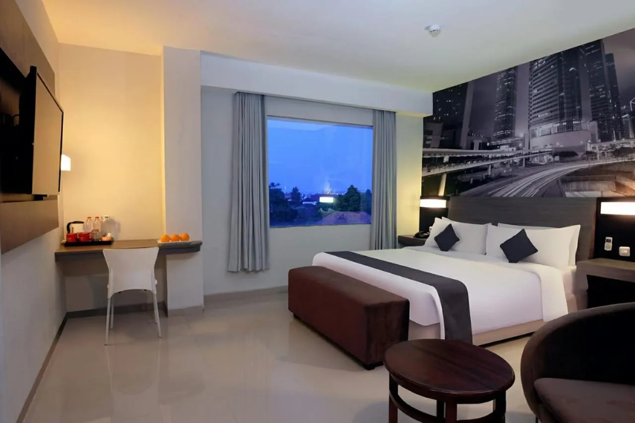 Photo of the whole room, Bed in Hotel Neo Candi Simpang Lima - Semarang by ASTON