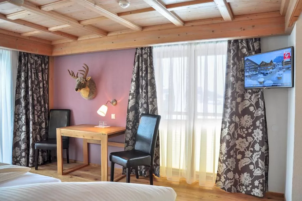 Living room, Bed in Hotel Seelos