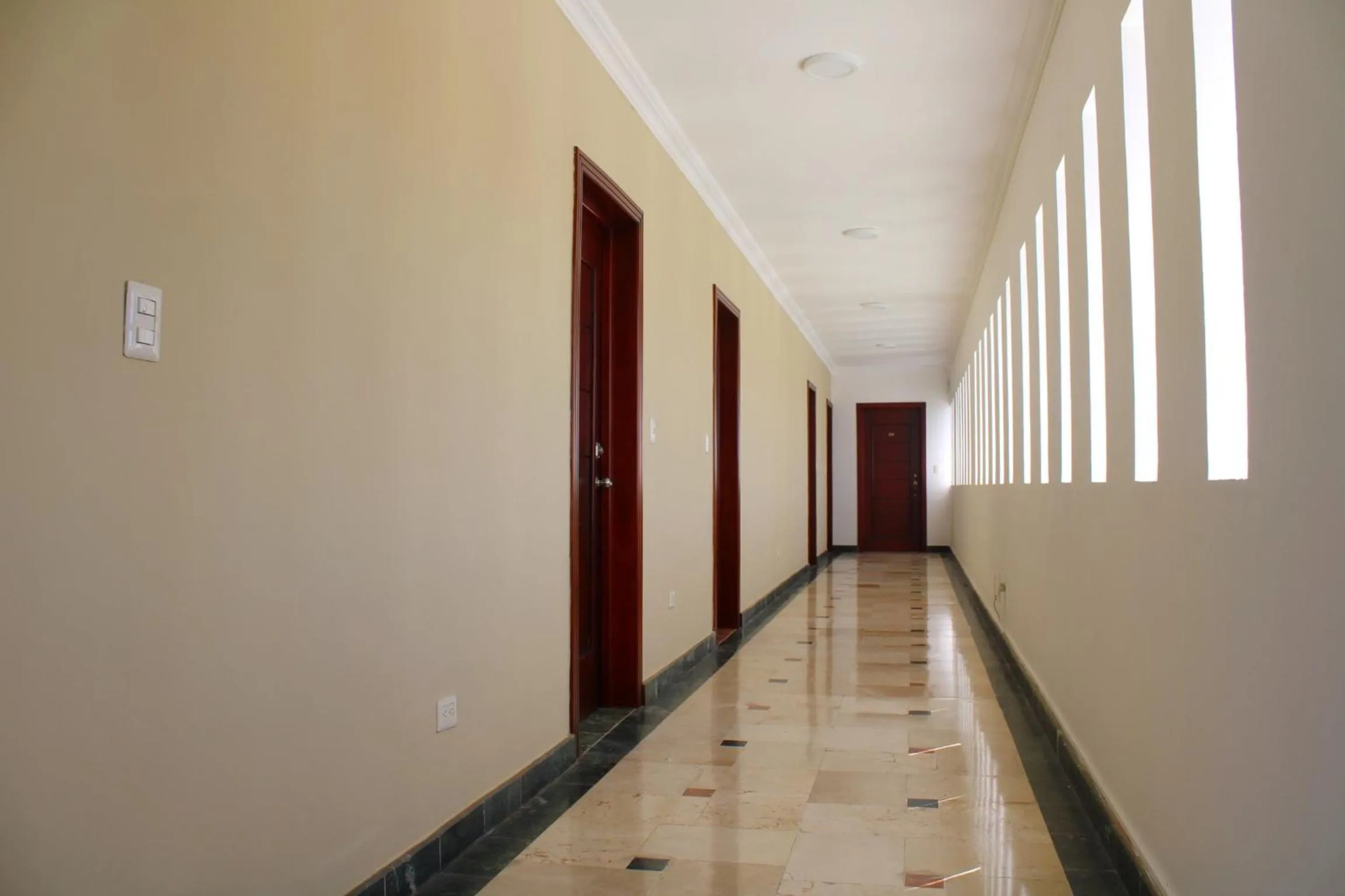 Property building in Hotel Checkin El Cortecito