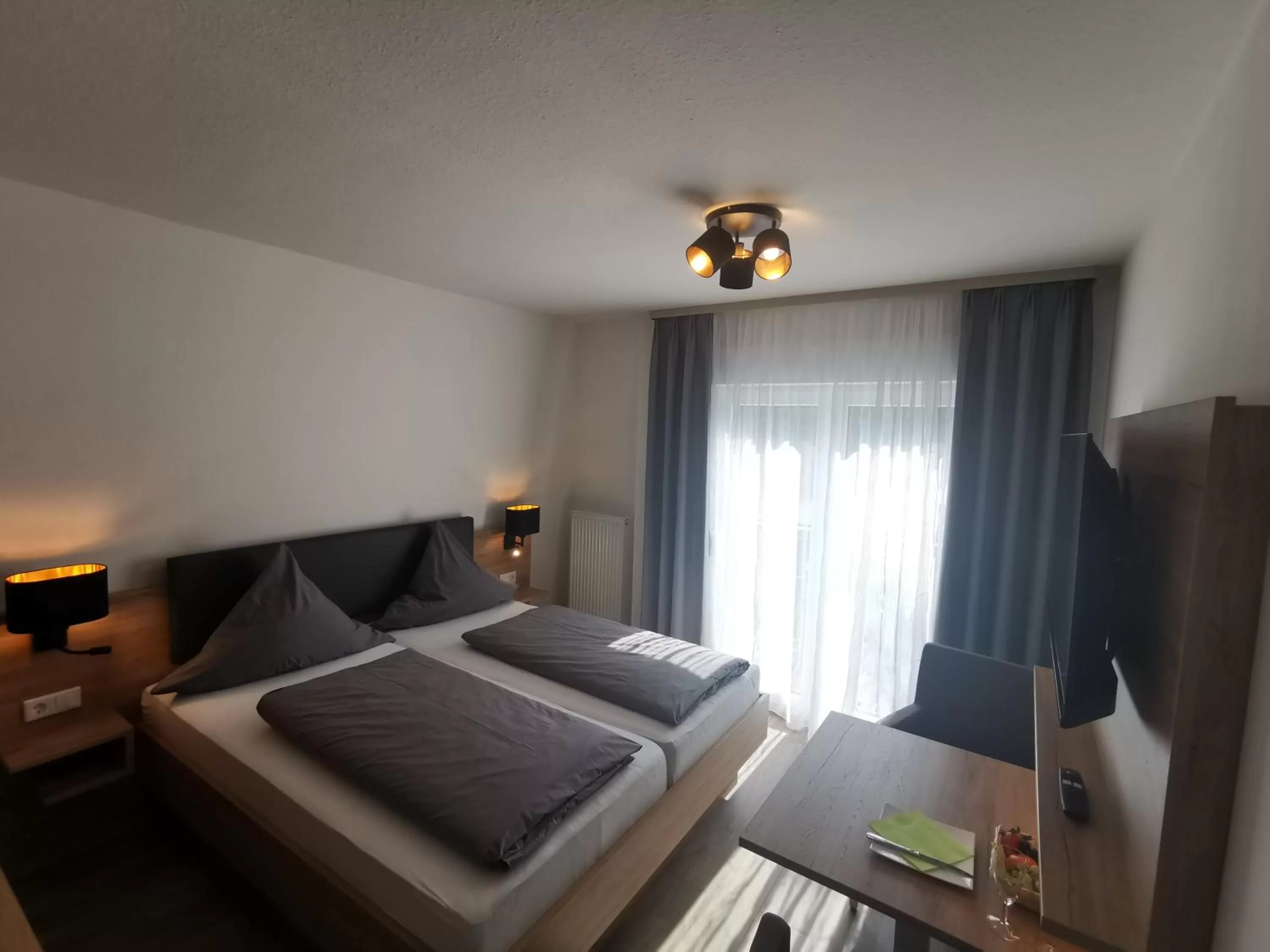 Photo of the whole room, Bed in Hotel Grüner Baum mit Restaurant & Wellness