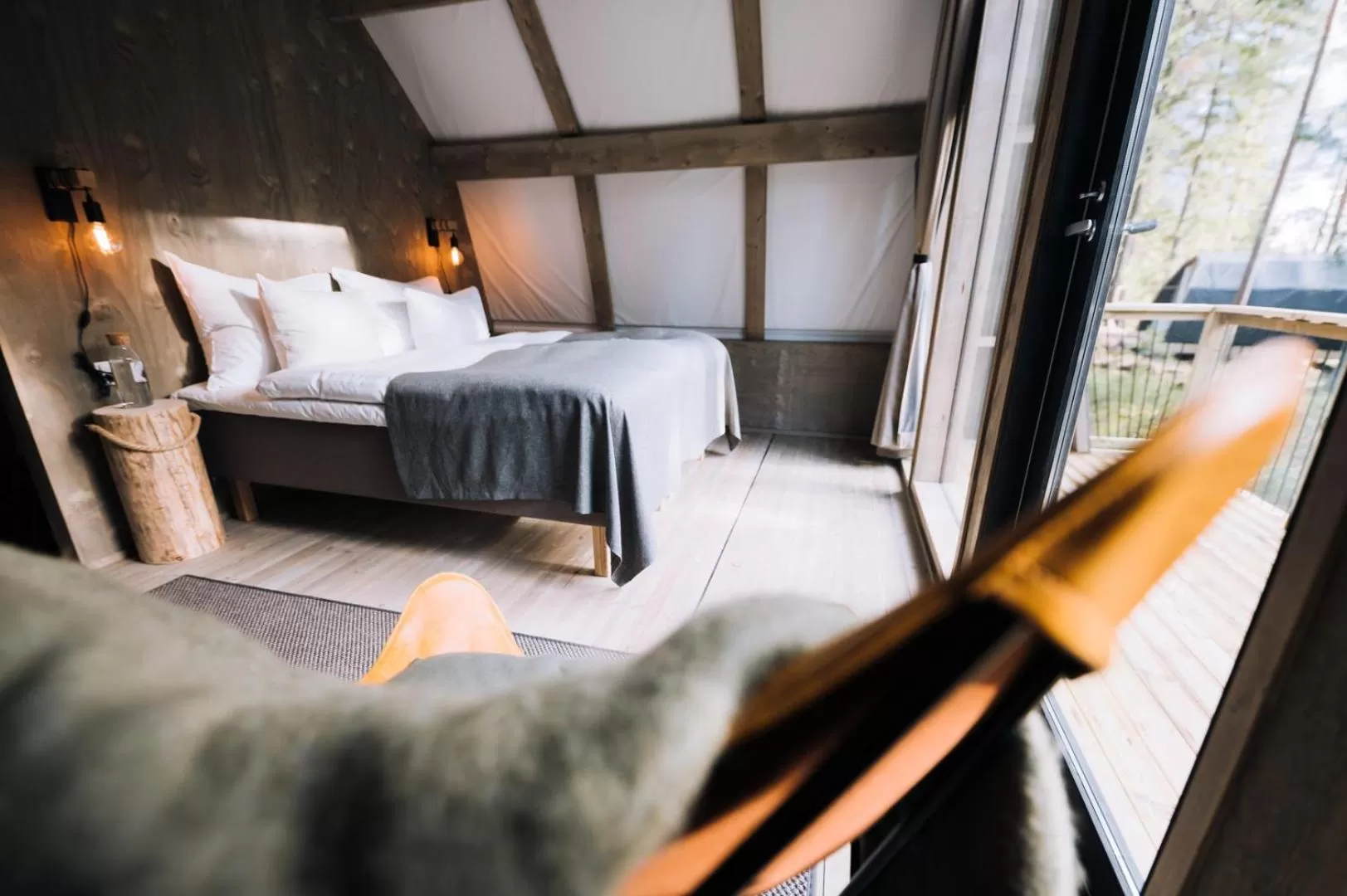 Bed in Haltia Lake Lodge nature boutique hotel & glamping