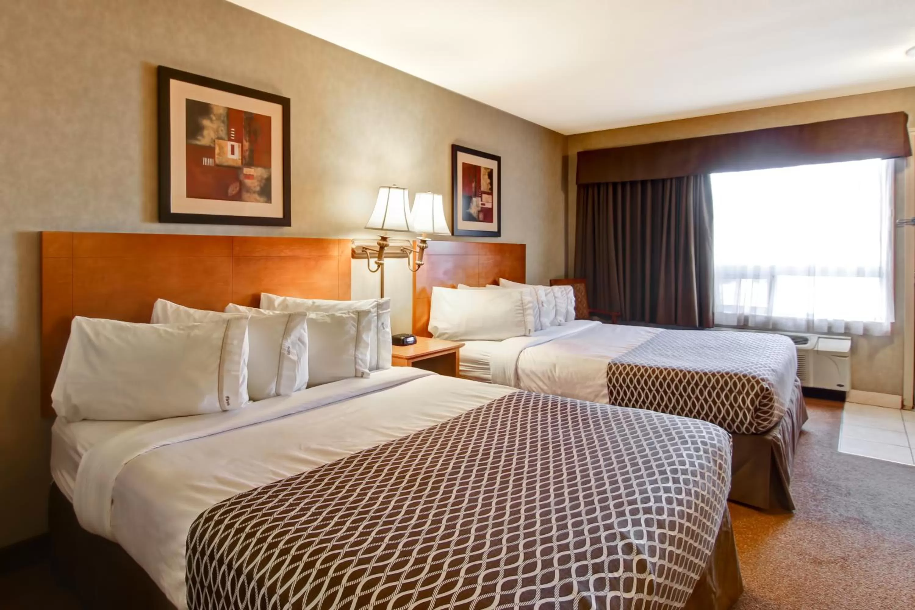 Swimming pool, Bed in Ramada by Wyndham Ponoka