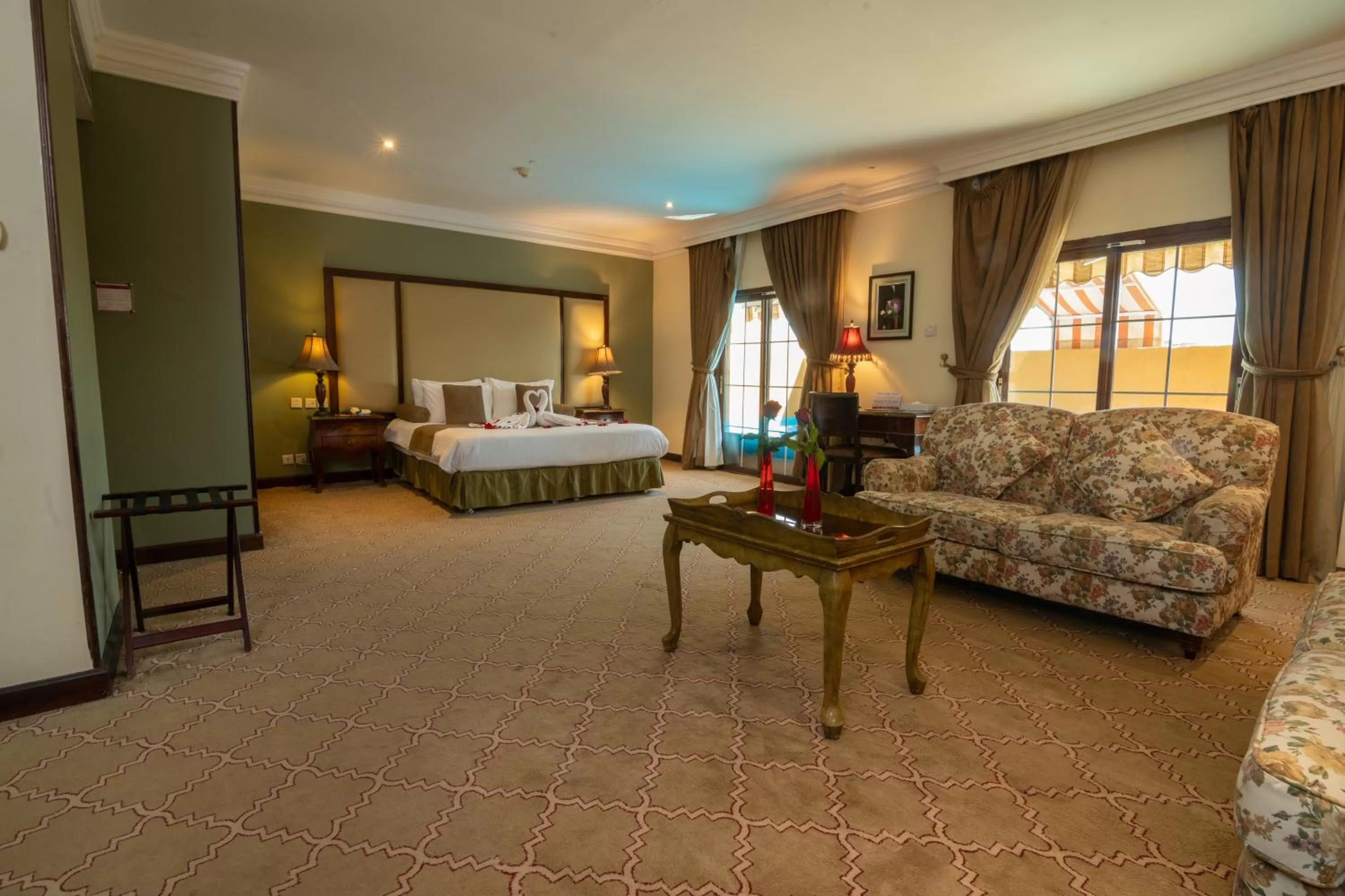 Bed in The Convention Center & Royal Suites Hotel