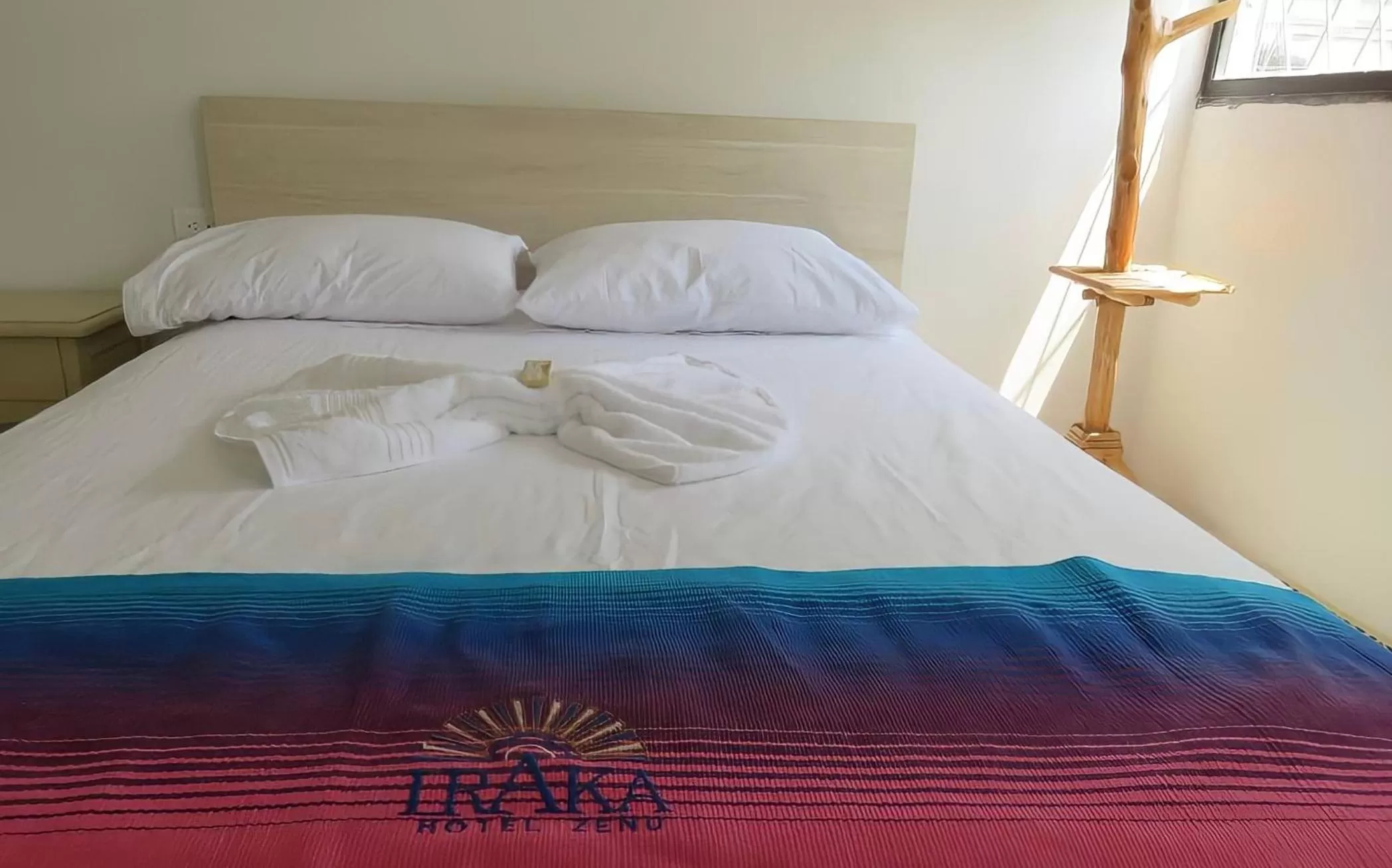 Bed in Hotel Iraka Zenu