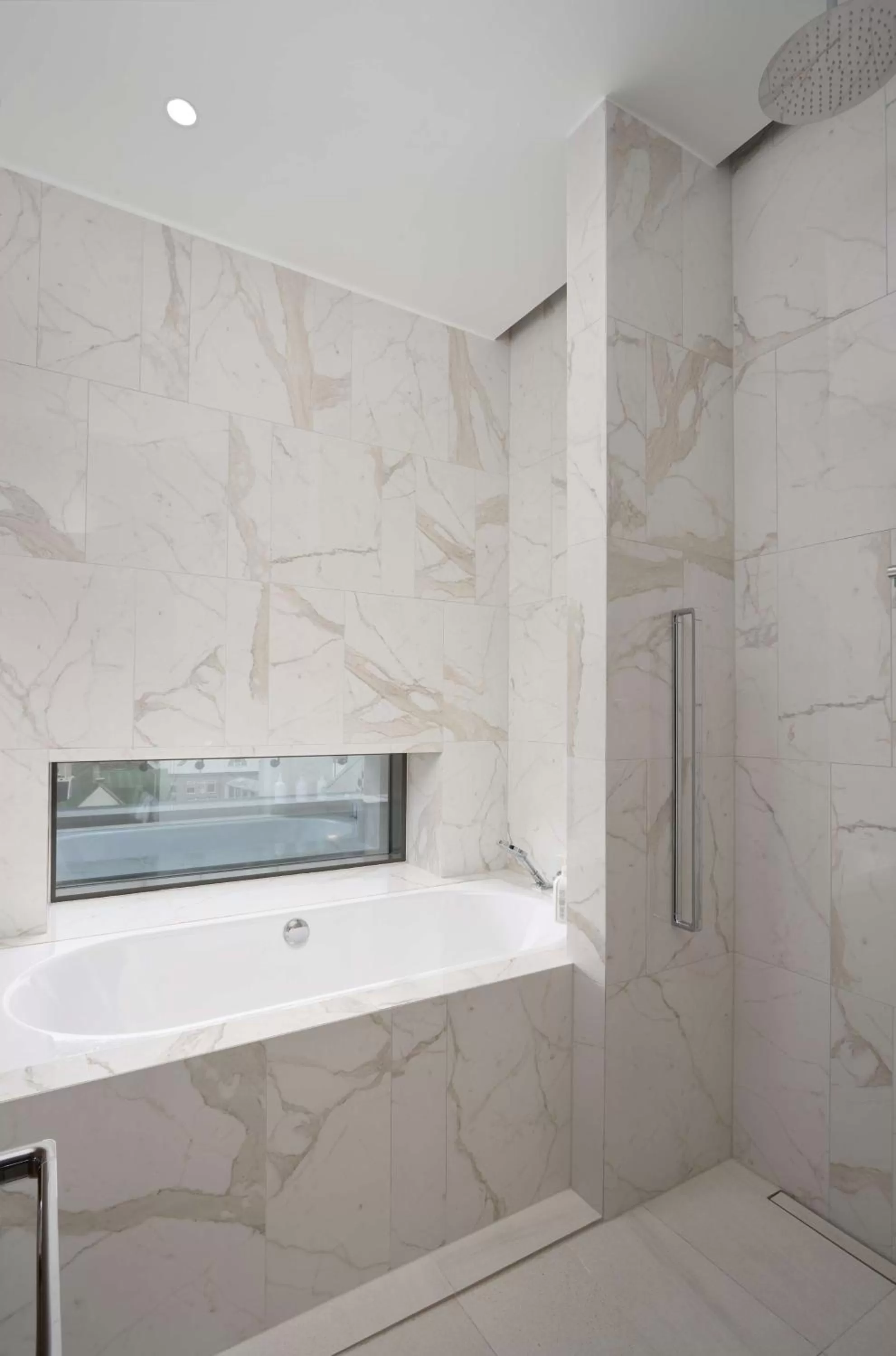 Bathroom in Iceland Parliament Hotel, Curio Collection By Hilton