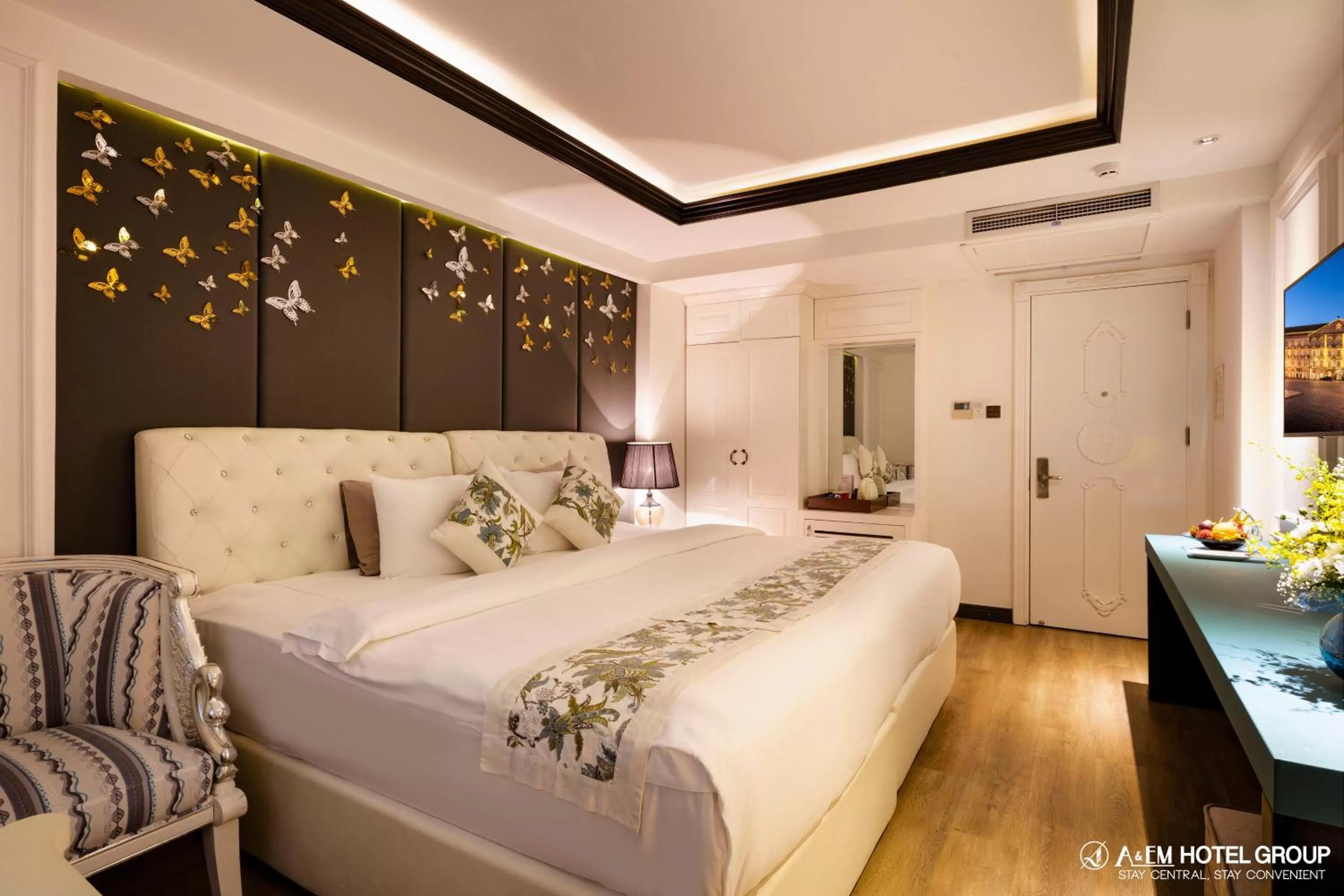 Bed in A&EM Saigon Hotel